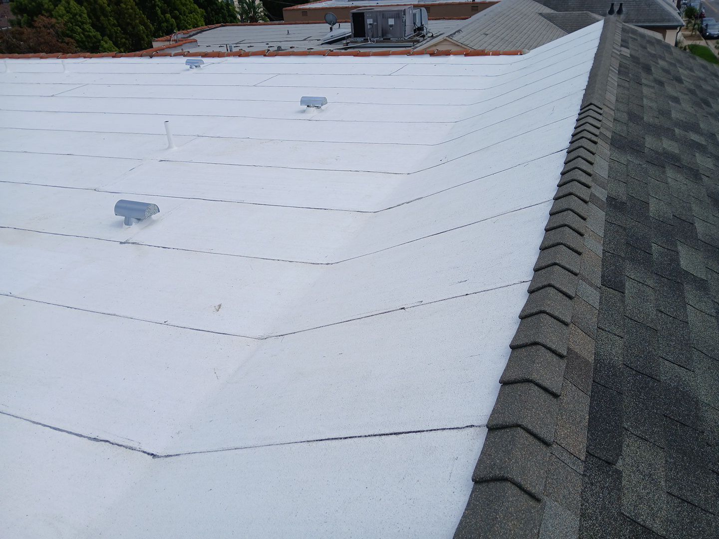 Apartment Building Reroofing using Polyfresko® G Highly Reflective Modified Bitumen Cap Sheet by Hull Brothers Roofing