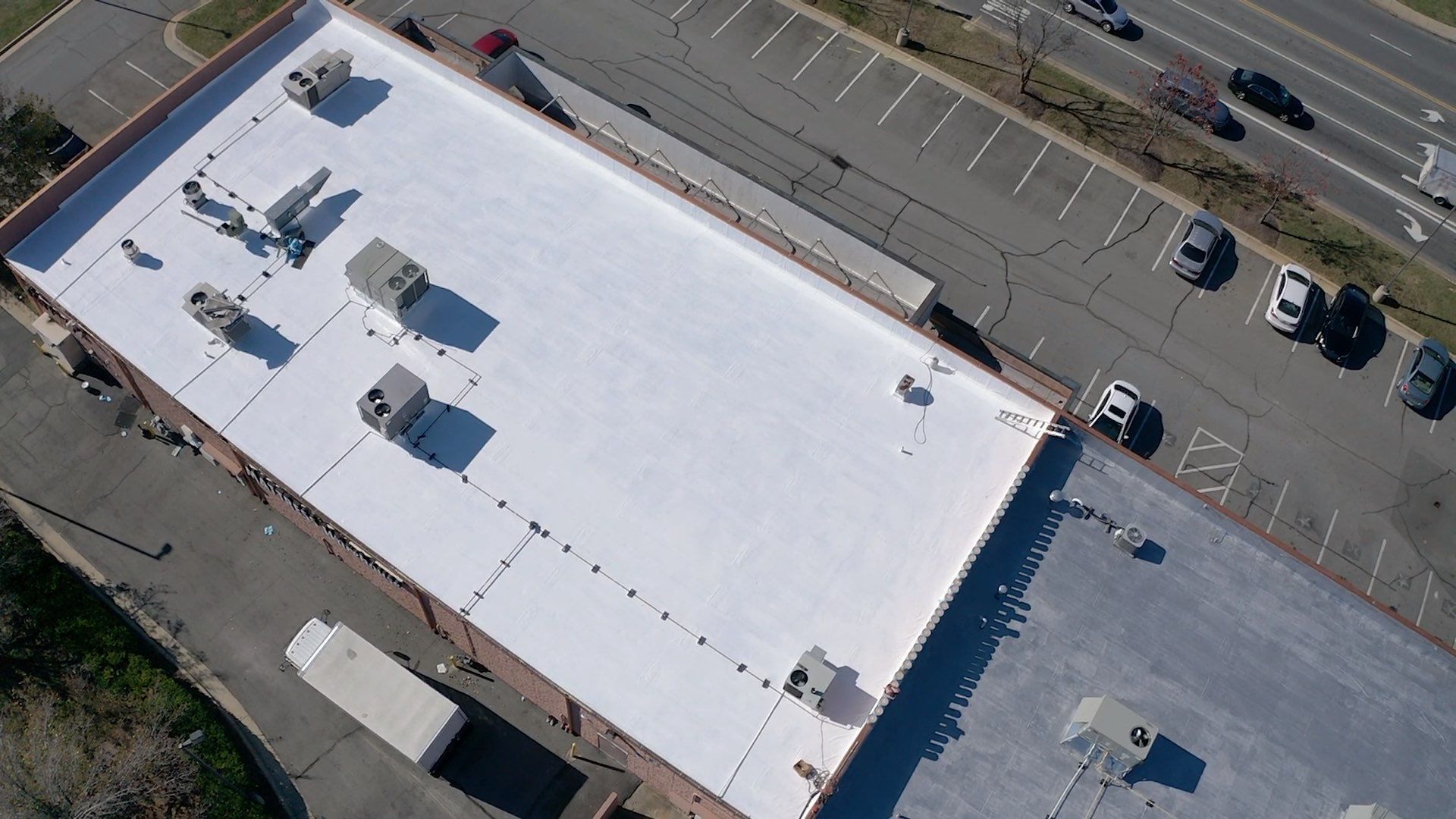 Commercial Coating using Poly Urerthane and Silicone Coating by Just In Time Roofing and Restoration