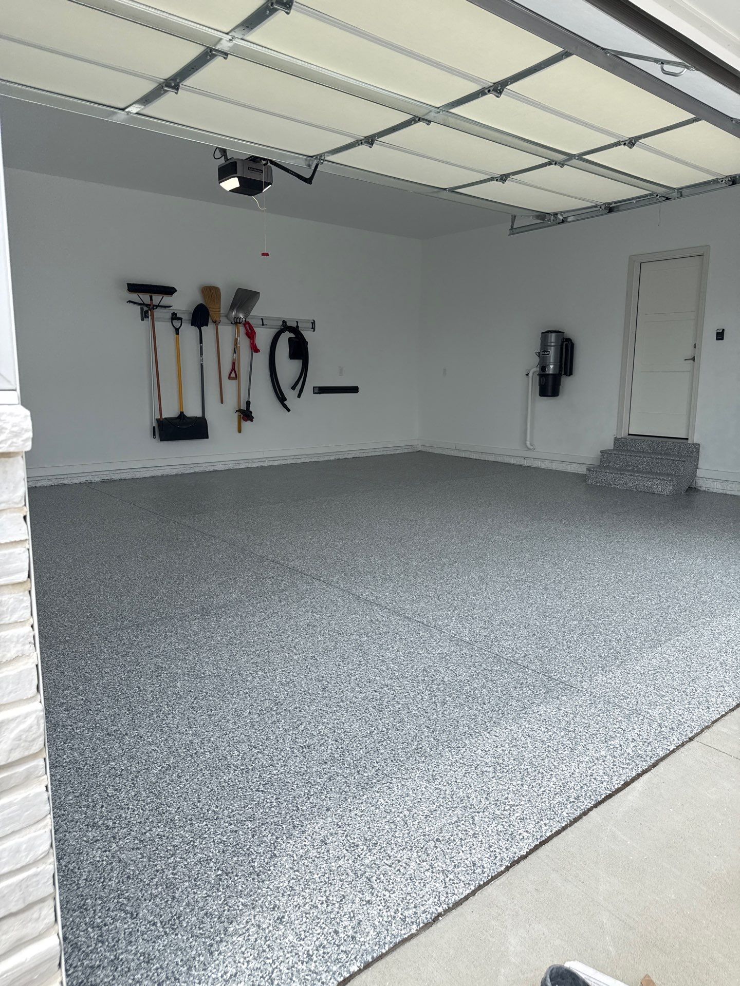 Gravel Flake Garage and Patio Floor Coating for Boone Residence by Revival Concrete Coatings