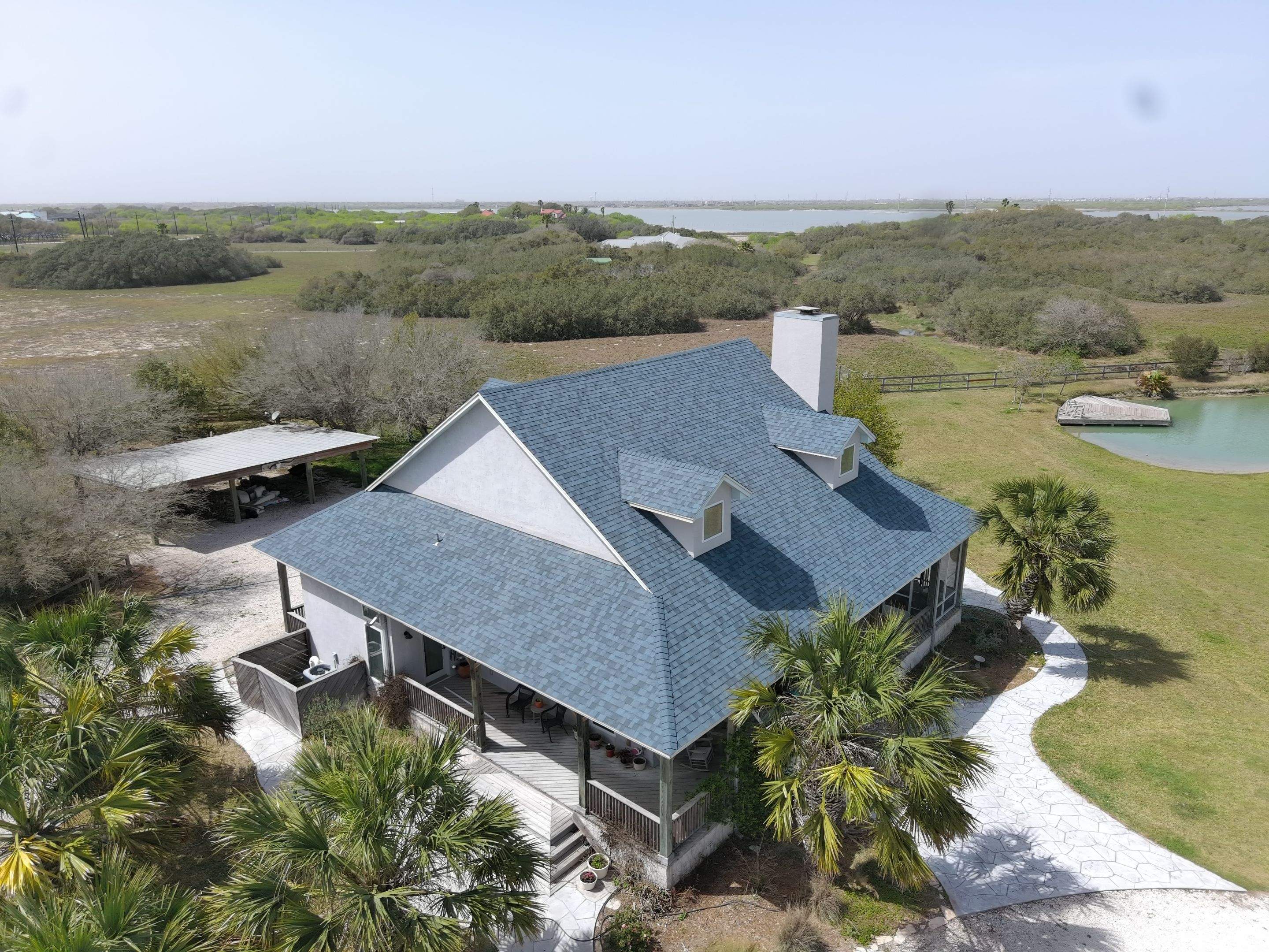 Long Horn Retreat by Bayfront Roofing and Construction