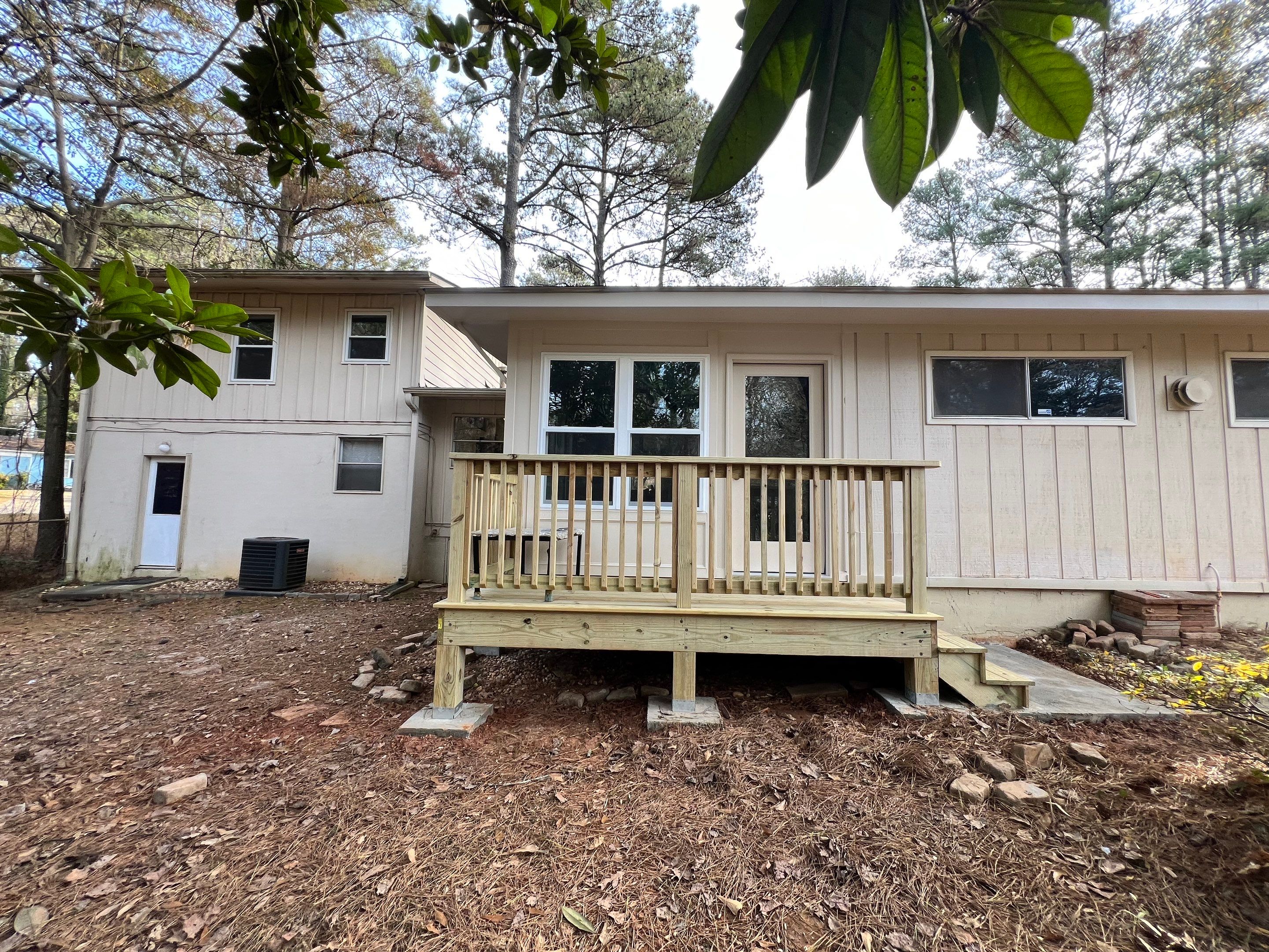 Sunroom Conversion and Pressure Treated Deck Installation in Doraville by Swift Home Renovations