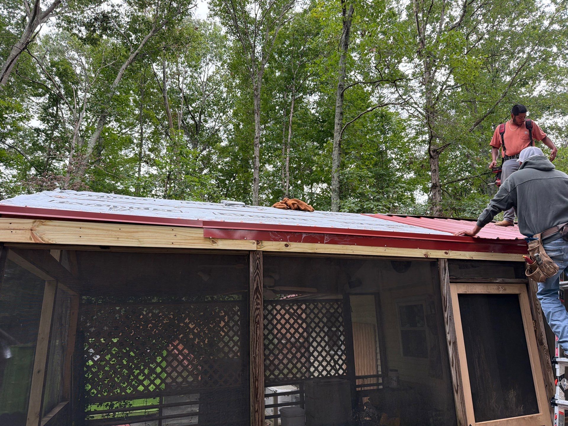 Red Metal Roof Restoration and Wood Fascia Replacement in Barboursville by Cade Construction