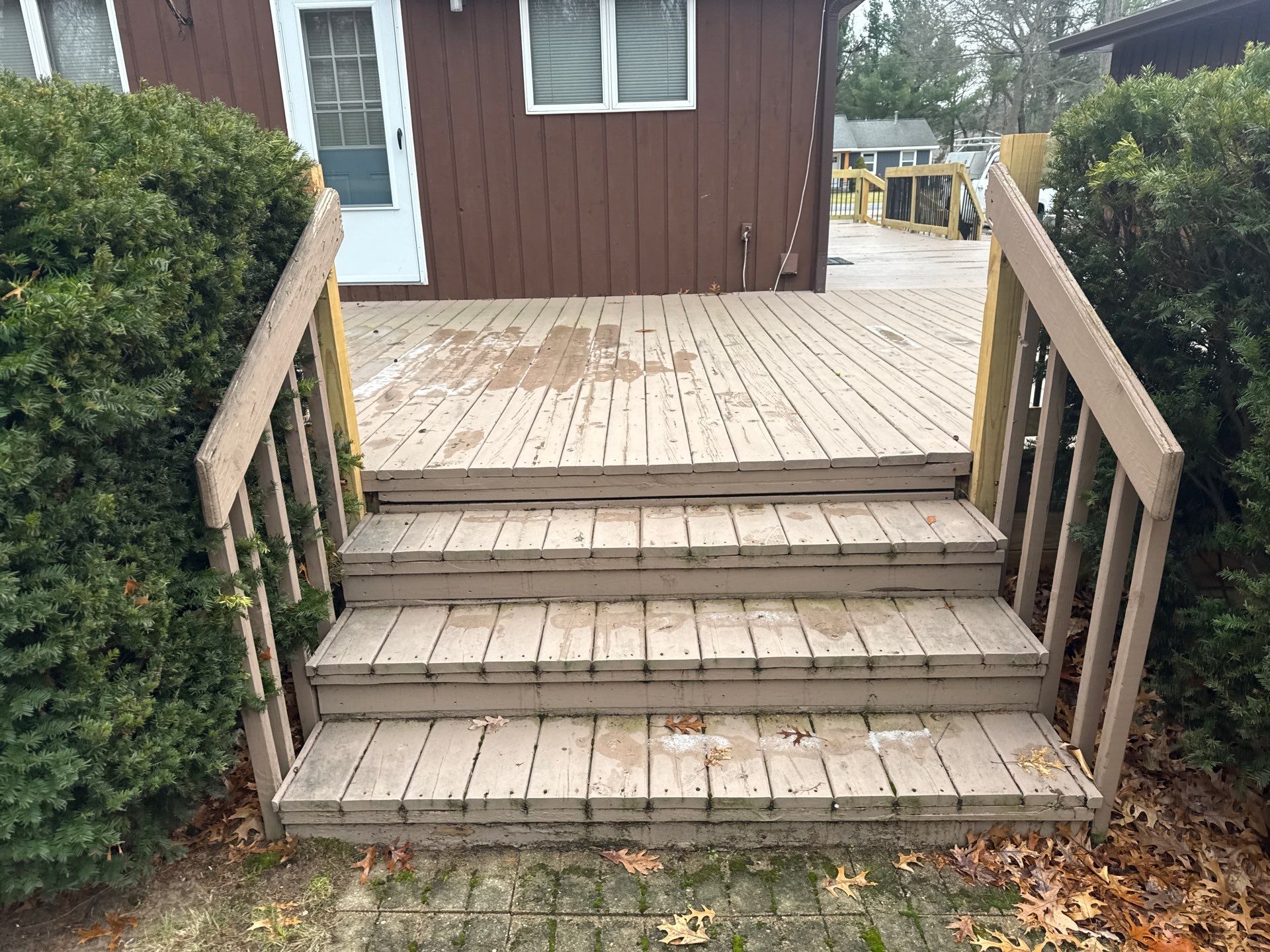 Muskegon Deck Restoration with Pressure Treated Railings and Wood Staining by Gordon Painting