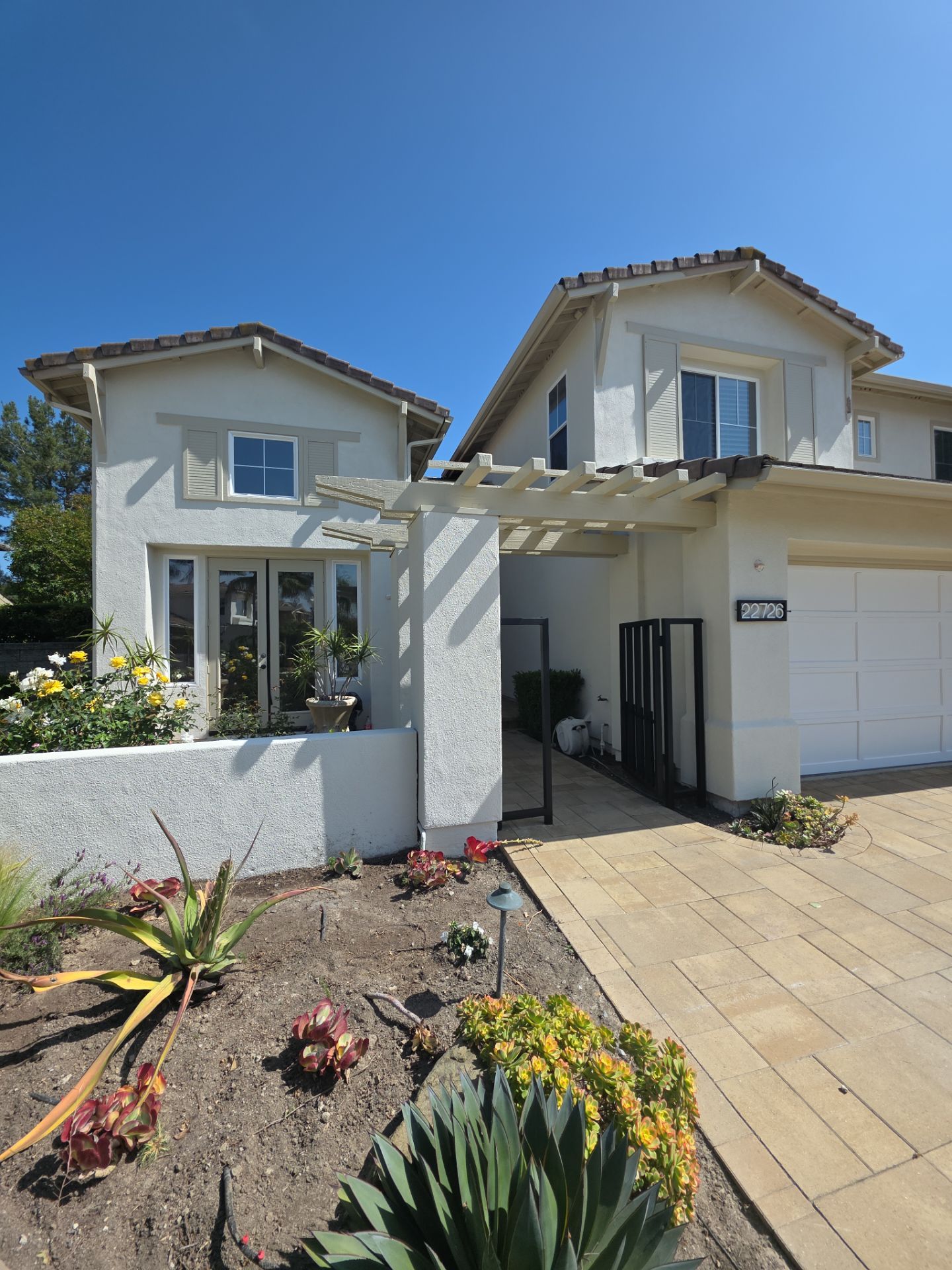Exterior painting of this newly remodeled Mission Viejo home. by Beach City Painting