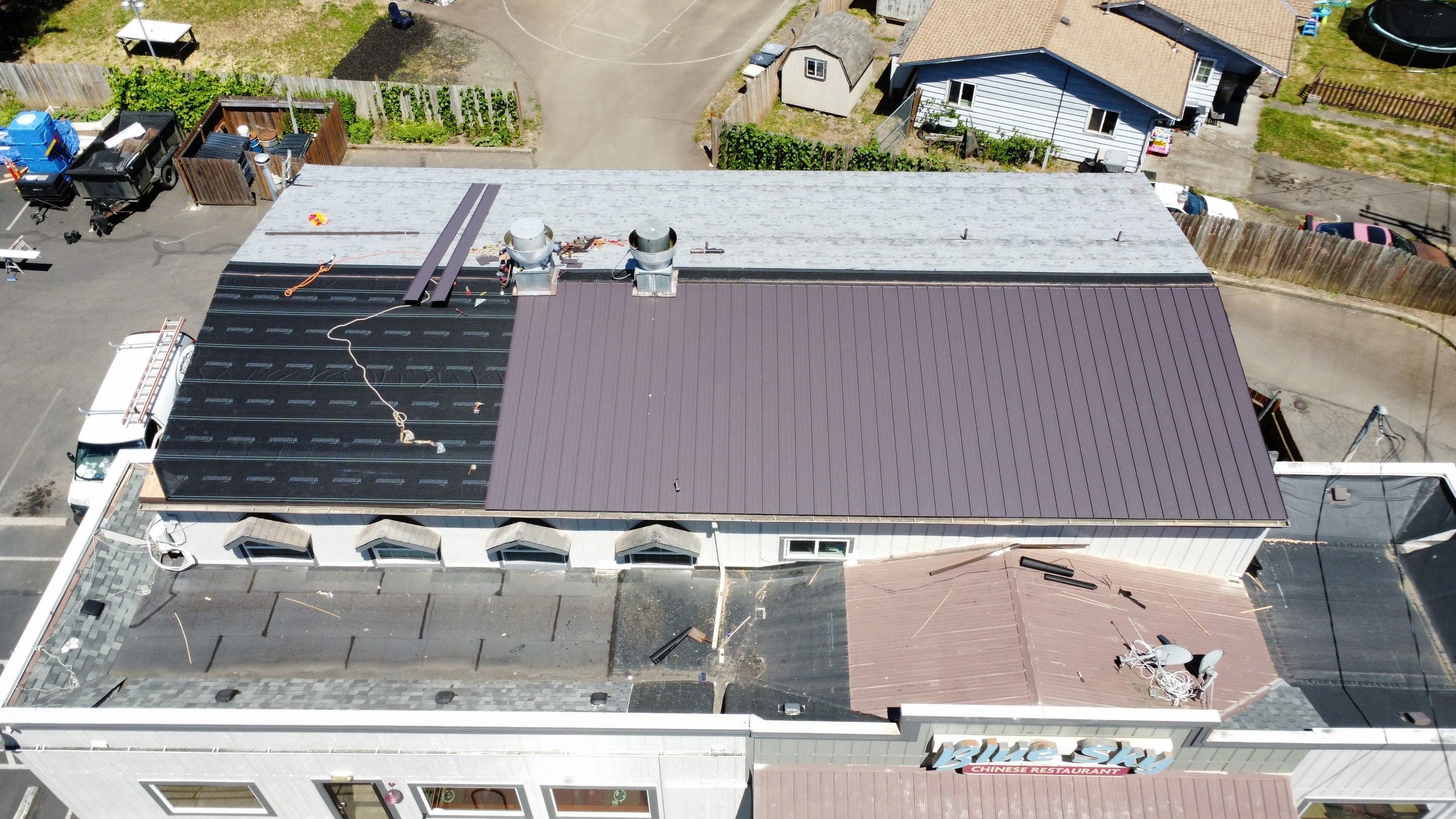 Commercial Flat Roof Installation using Bruce and Dana Snap Lock Metal (Color: Brown) by Orezona Building & Roofing Company, Inc.