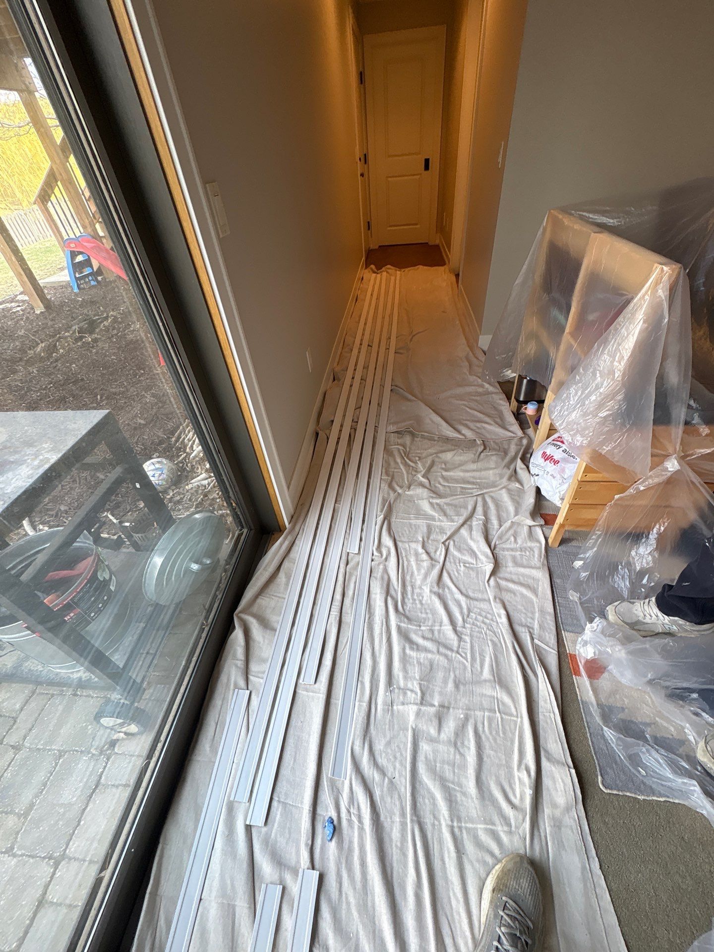 Sioux Falls Interior Painting with Custom Wainscoting and Decorative Wallpaper by Select Painting, Coatings & Garage Cabinets