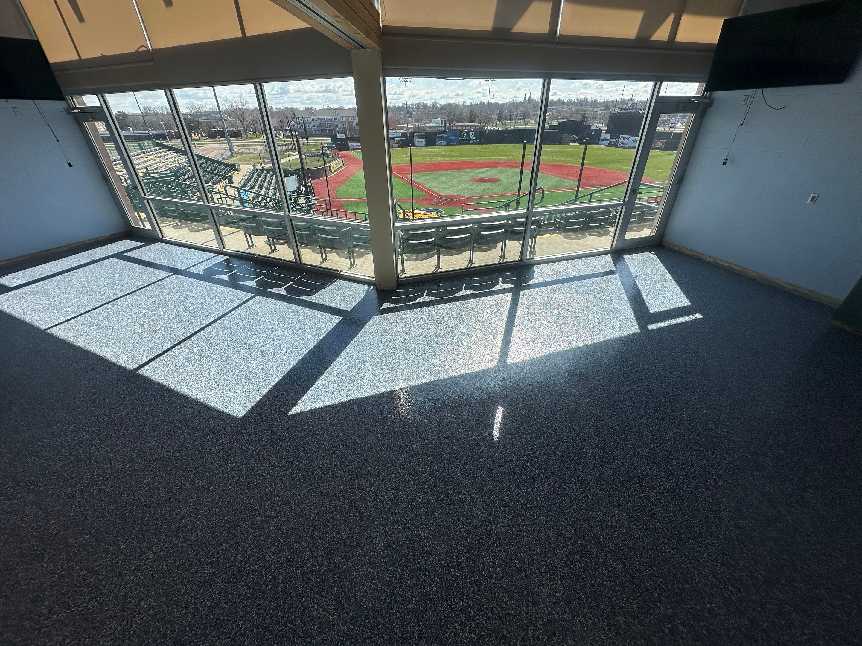 Commercial Epoxy Floor Coating for Stadium Viewing Suites in Sioux Falls by Select Painting, Coatings & Garage Cabinets