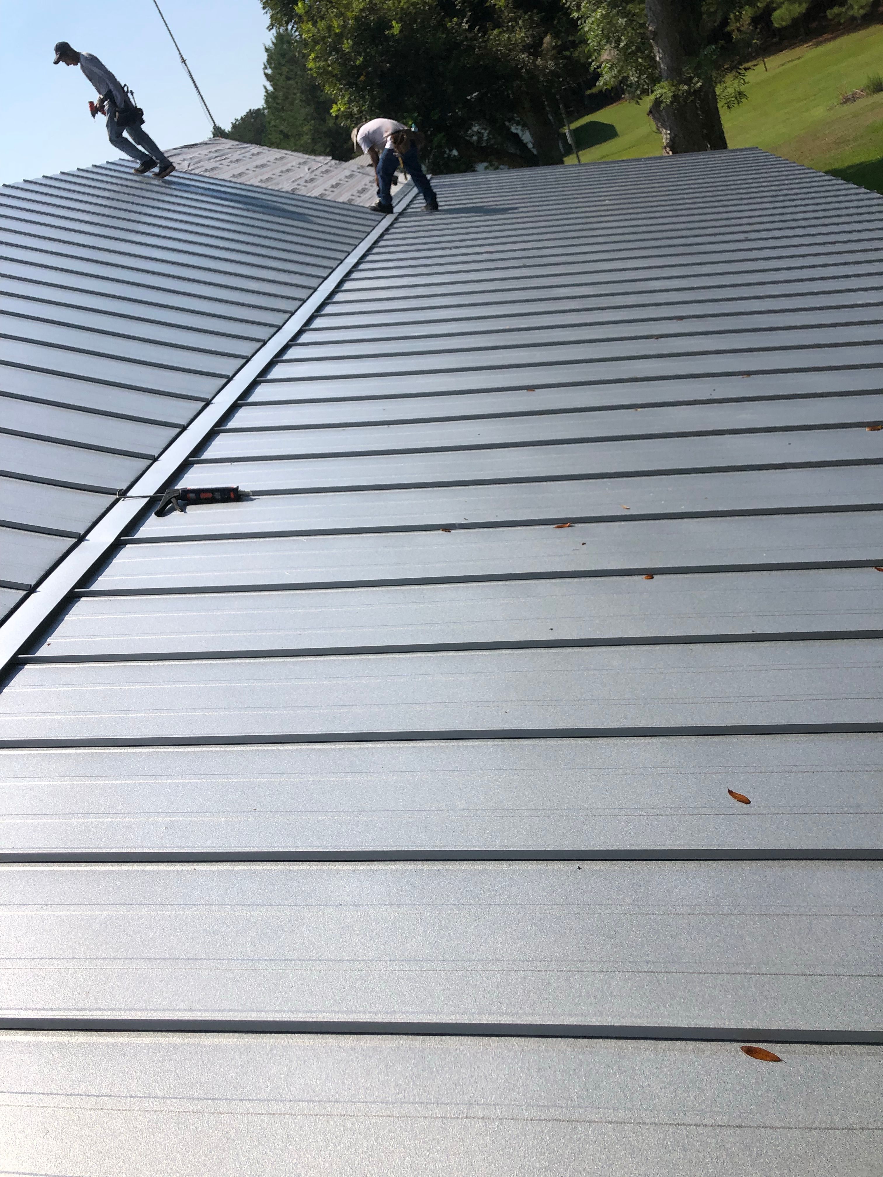 Residential Roofing Installation using Metal roofing by American Roofing & Construction LLC