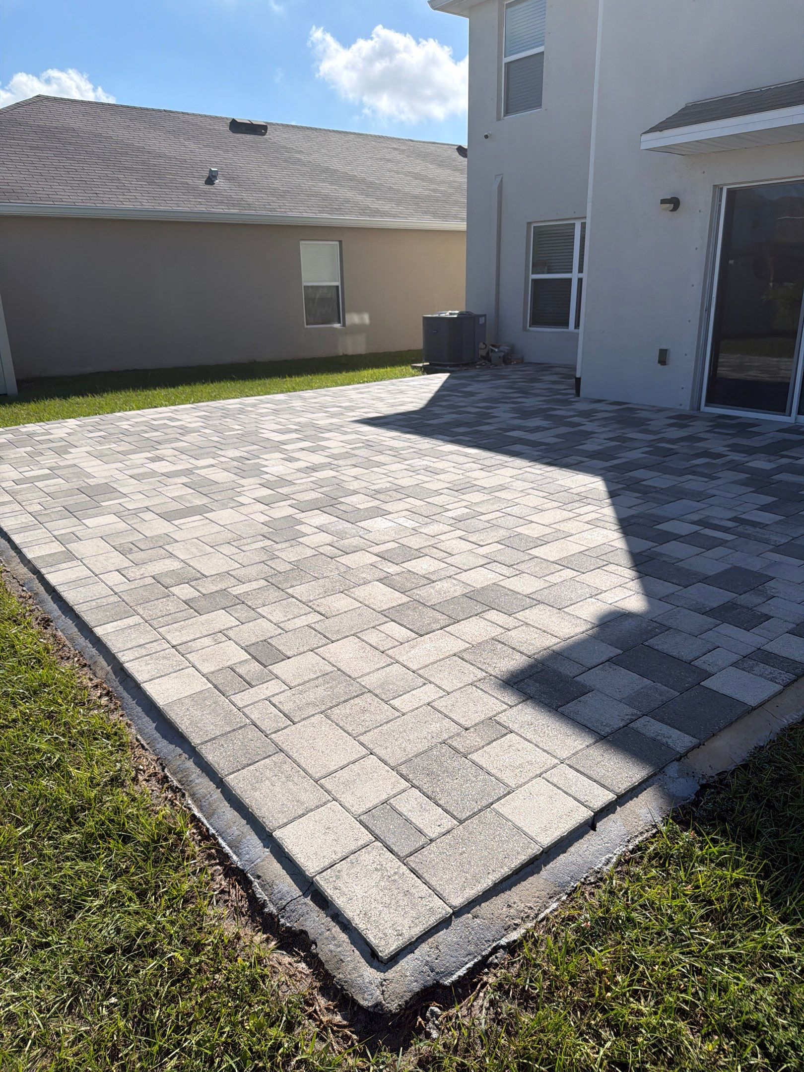 Paver Sealing and Restoration for Large Multi-Toned Patio in Wimauma by Supreme Paver Experts