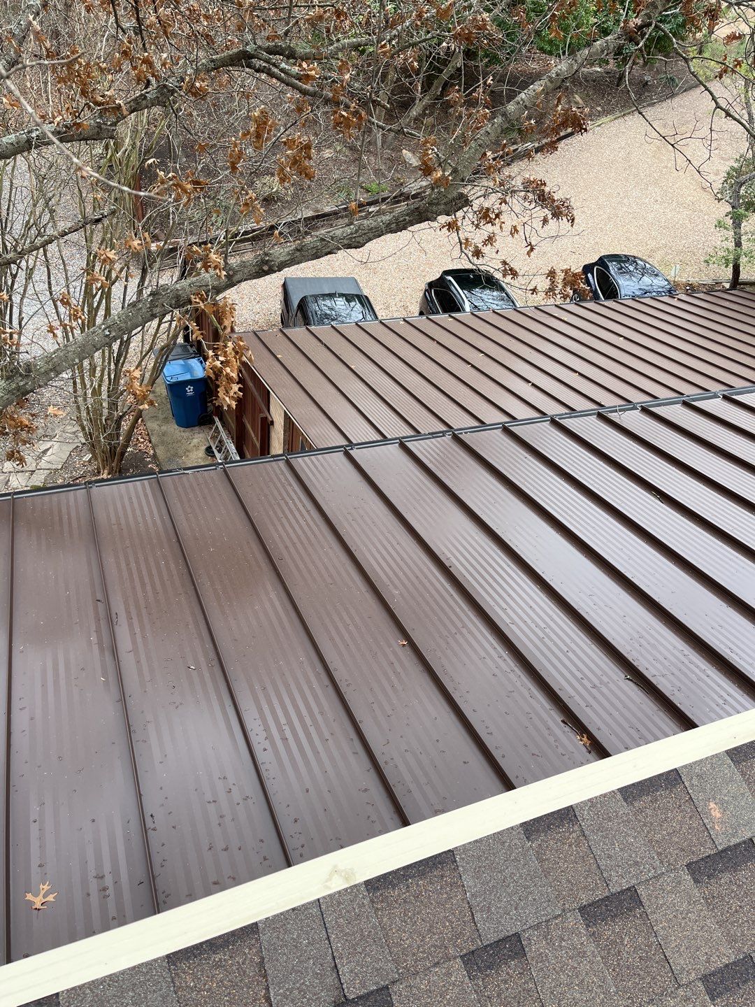 Residential Roofing Installation using Standing Seam Metal Roofing and Composition Shingles by Rainy Day Restoration