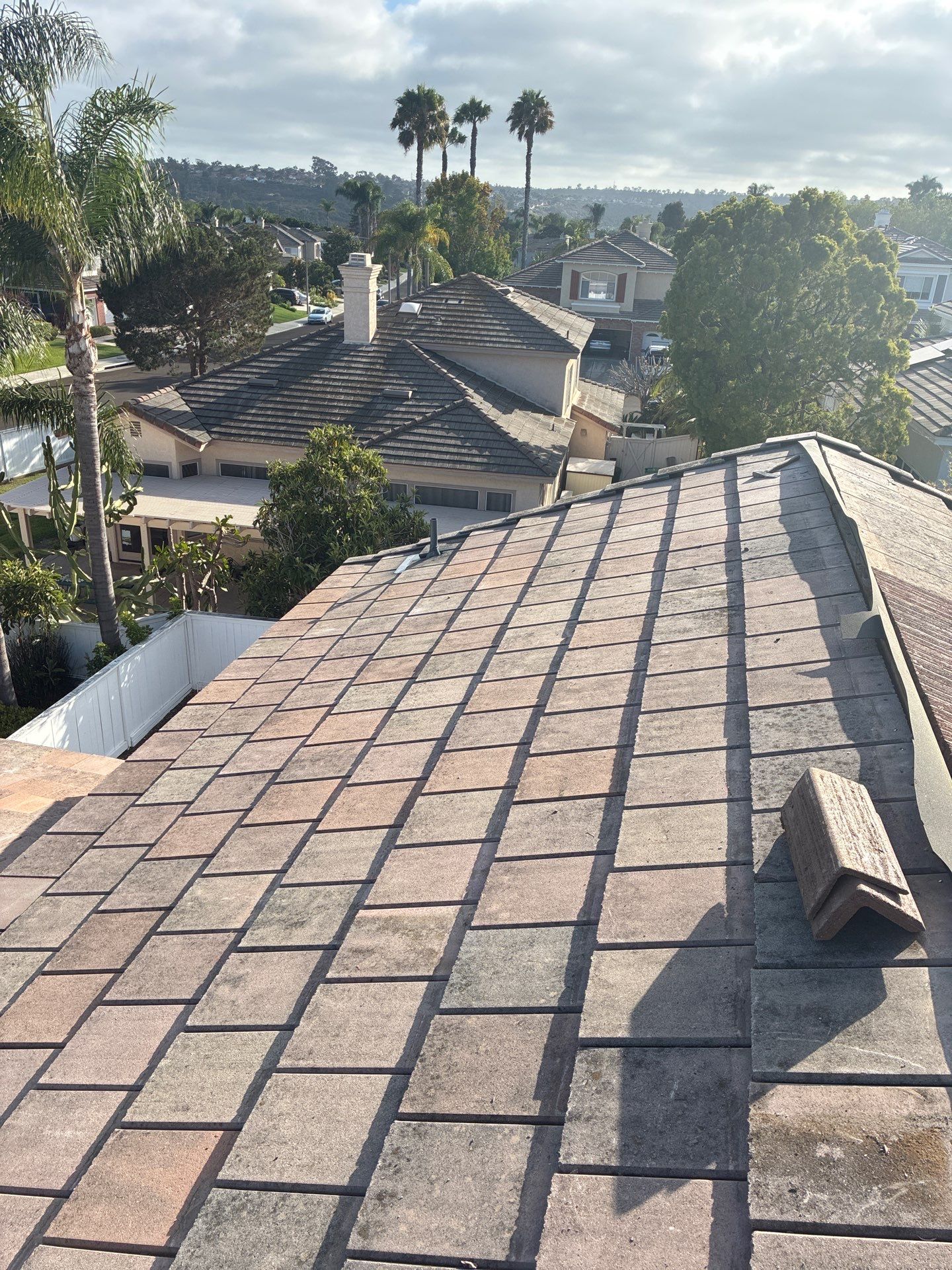 Carlsbad Concrete Tile Roof Replacement with Copper Flashing and Skylights by Reliable Roofing San Diego Inc.