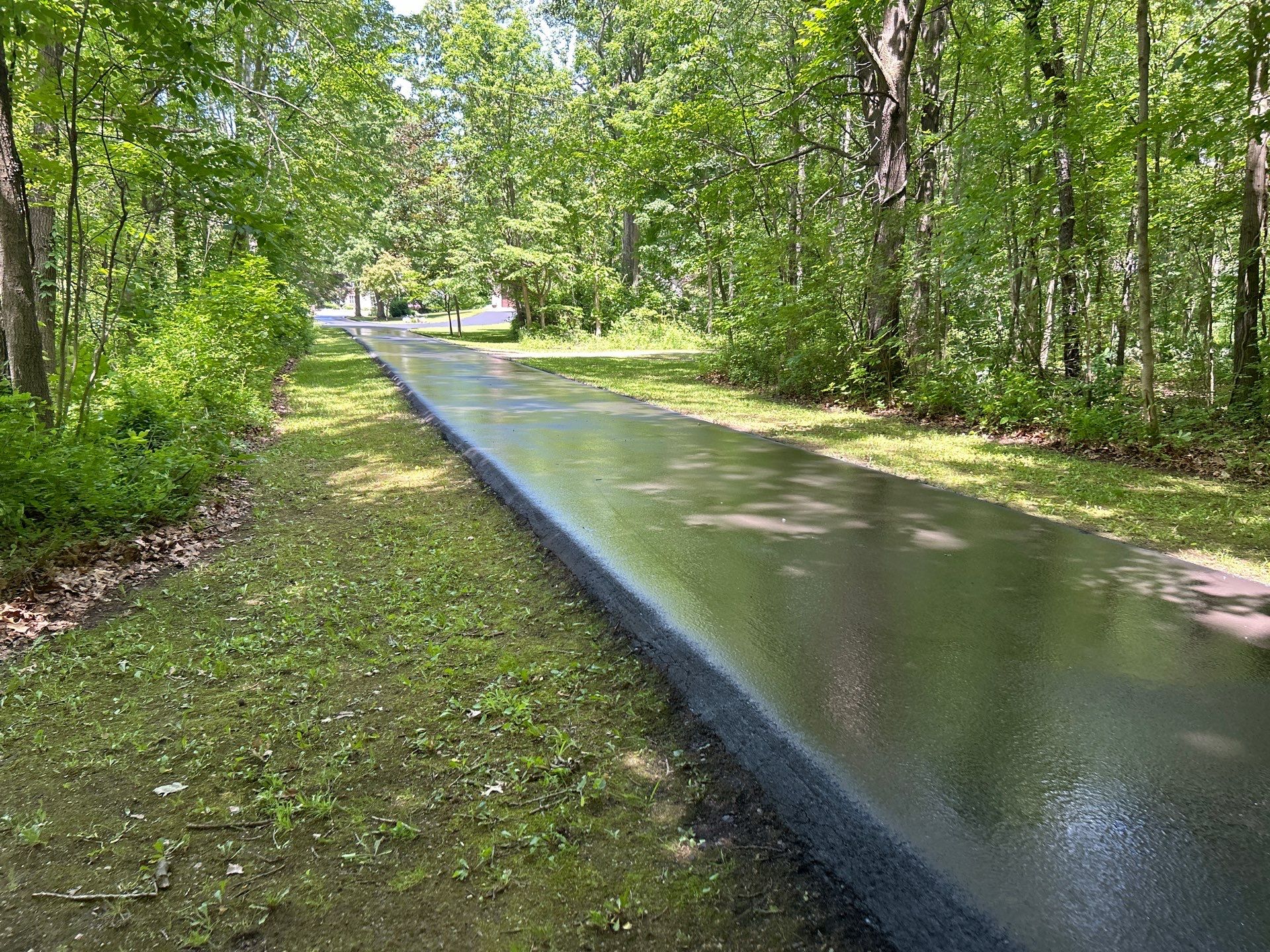 High end residential driveway by Quality Asphalt & Maintenance LLC