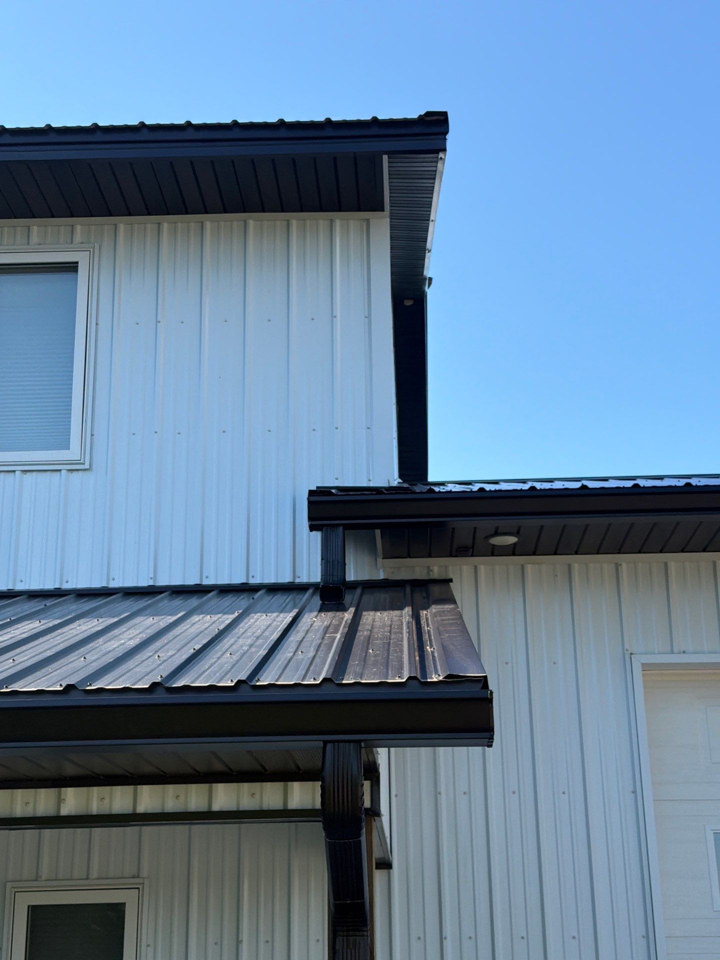Black Seamless Gutter Installation for barndominium in Buffalo by Next Level Seamless Gutters / Exteriors Inc.