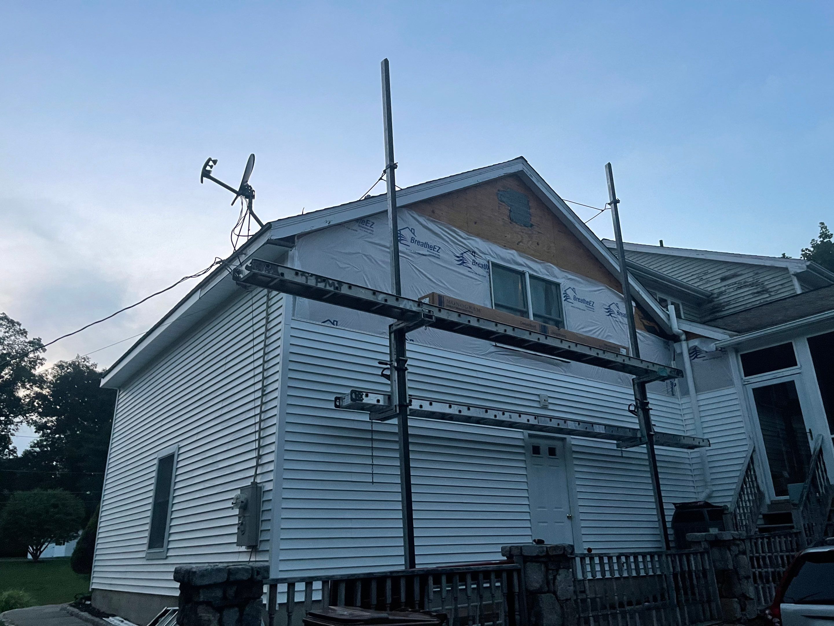 Siding Installation using Mainstreet Colonial & White gutters by A Plus Exterior