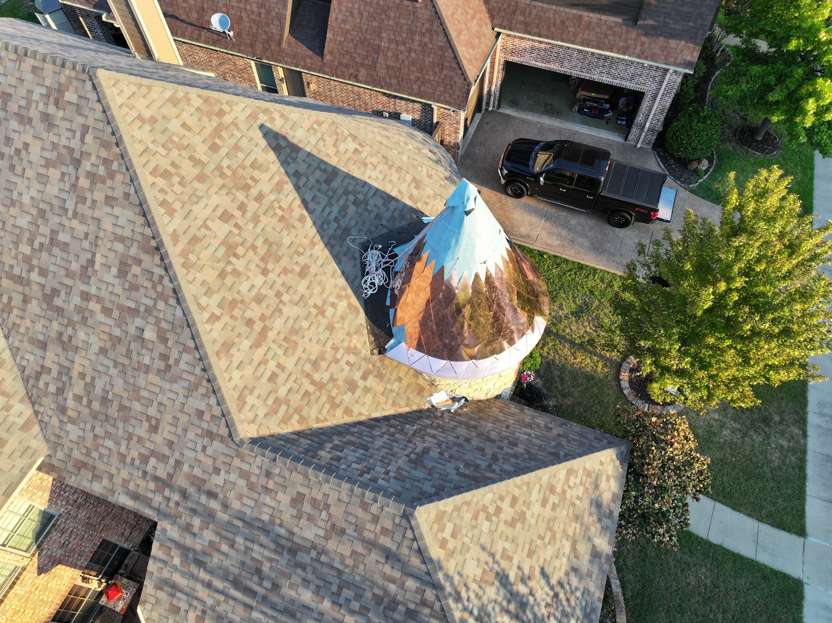 Installing Custom copper turret and Malarkey Vista Class 4 shingles Hail Damage Upgrade by Becker Roofing and Exteriors