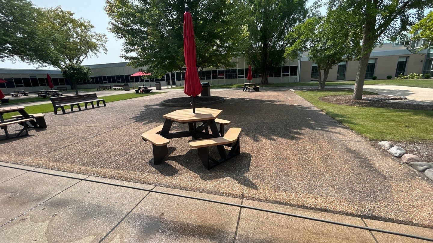 concrete using Algaecide, soft wash soap by Northern Power Washing LLC.