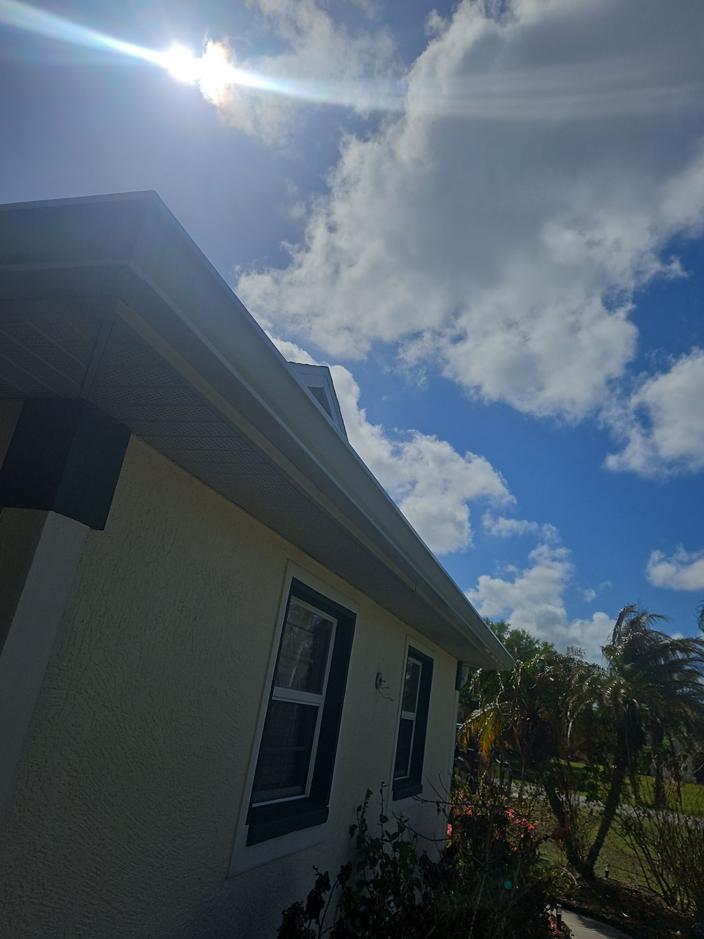 White seamless Gutters and downspout repair in Sarasota FL by Gutter Professors