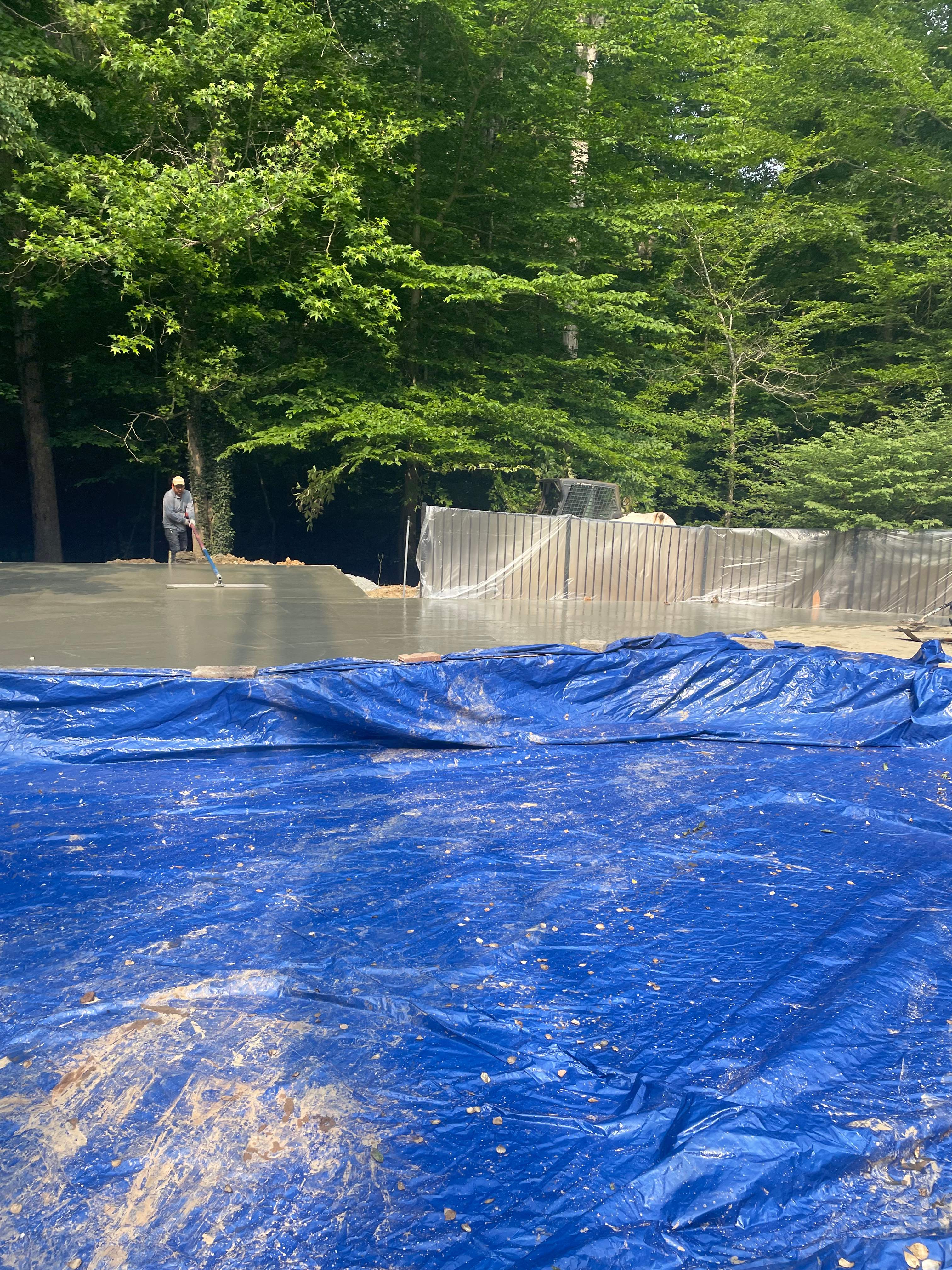 Pool Surround remodel with retaining walls, new waterfall and water slide by Fairfax Contractors, LLC