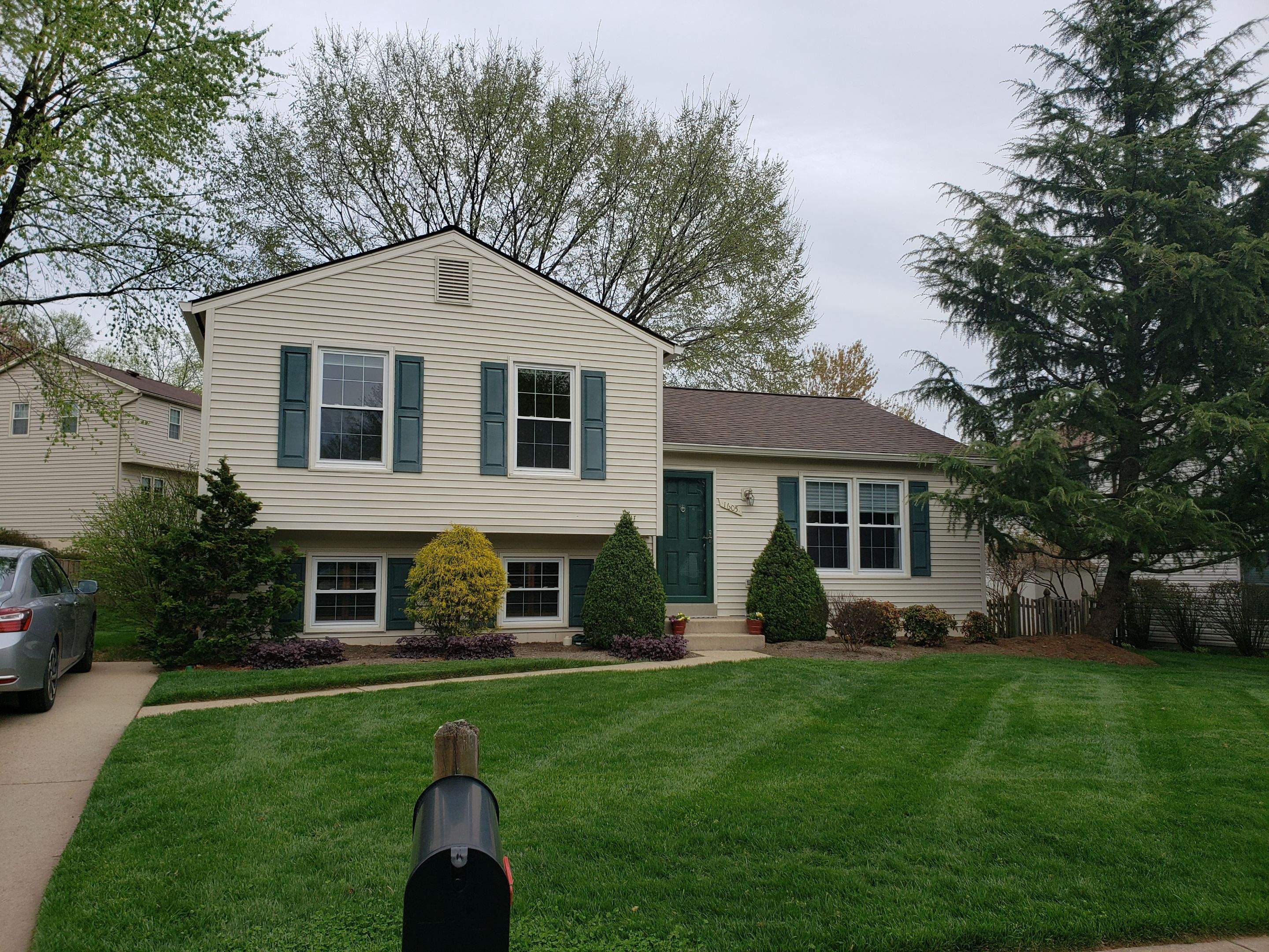 New composite windows and fiber cement siding with trim and gutters by Window Depot of Annapolis