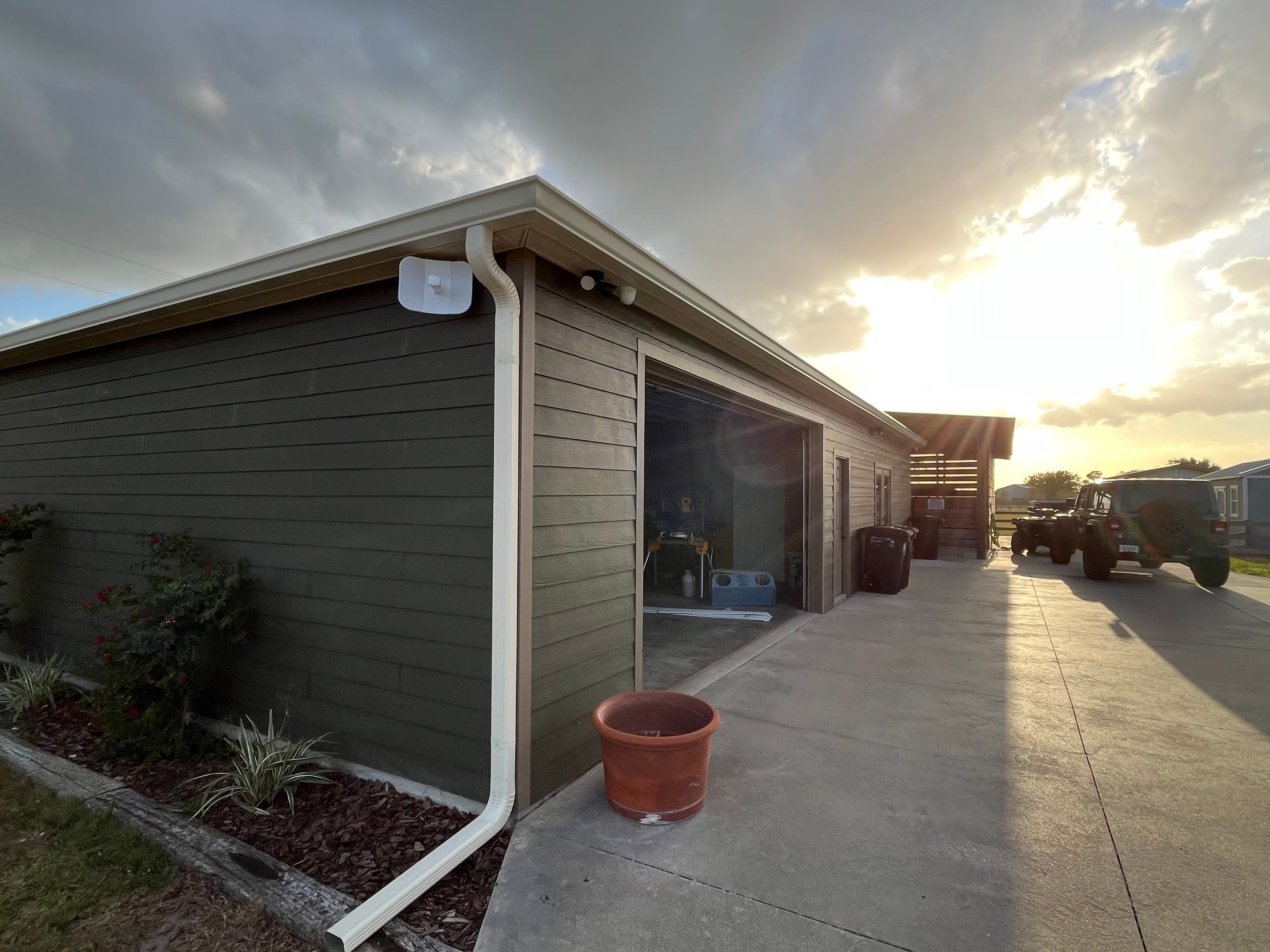  7-inch White seamless gutters and downspouts in Myakka City FL by Gutter Professors