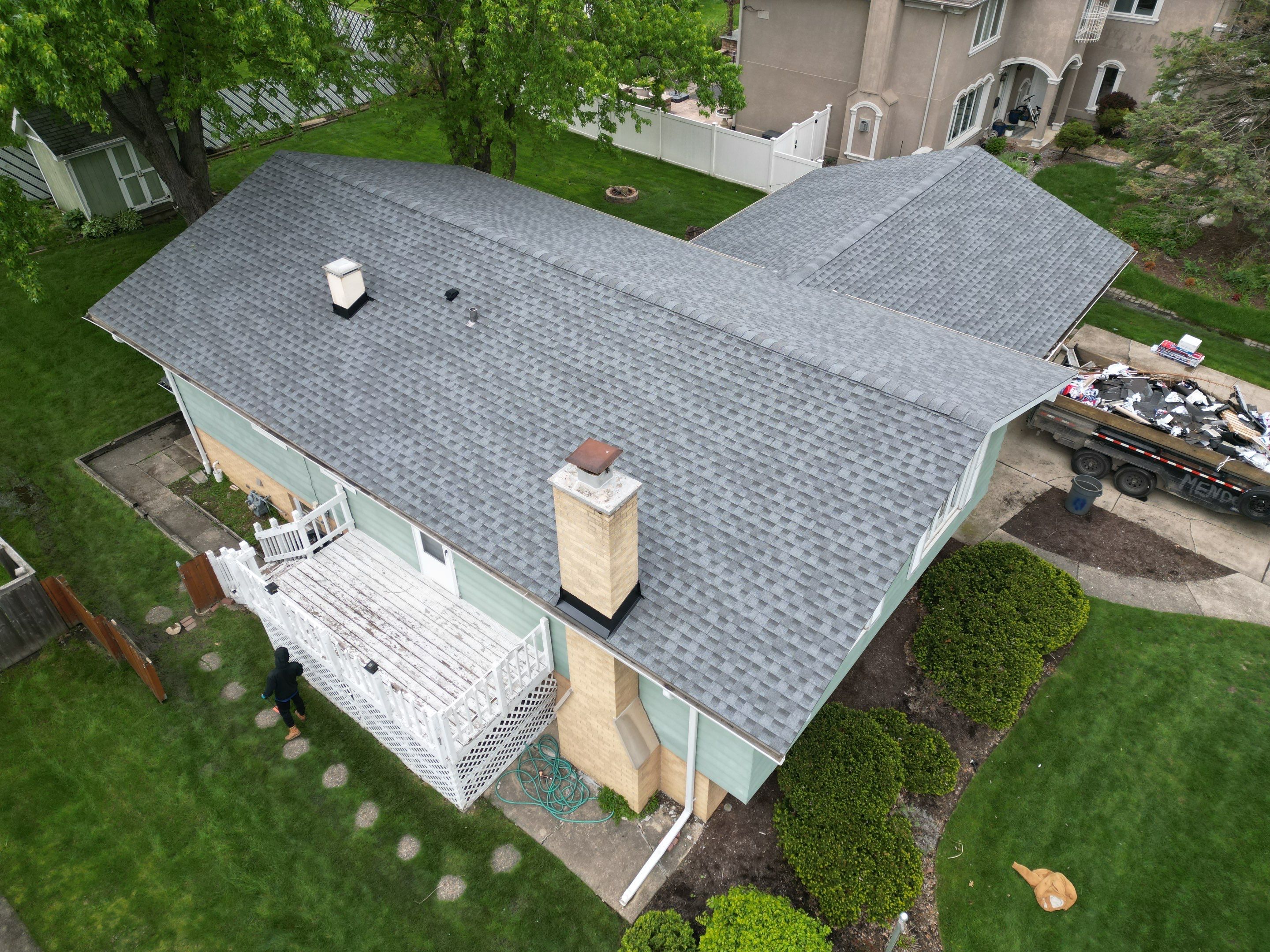 Roof replacement and chimney flashing by Optimal Home Improvement 