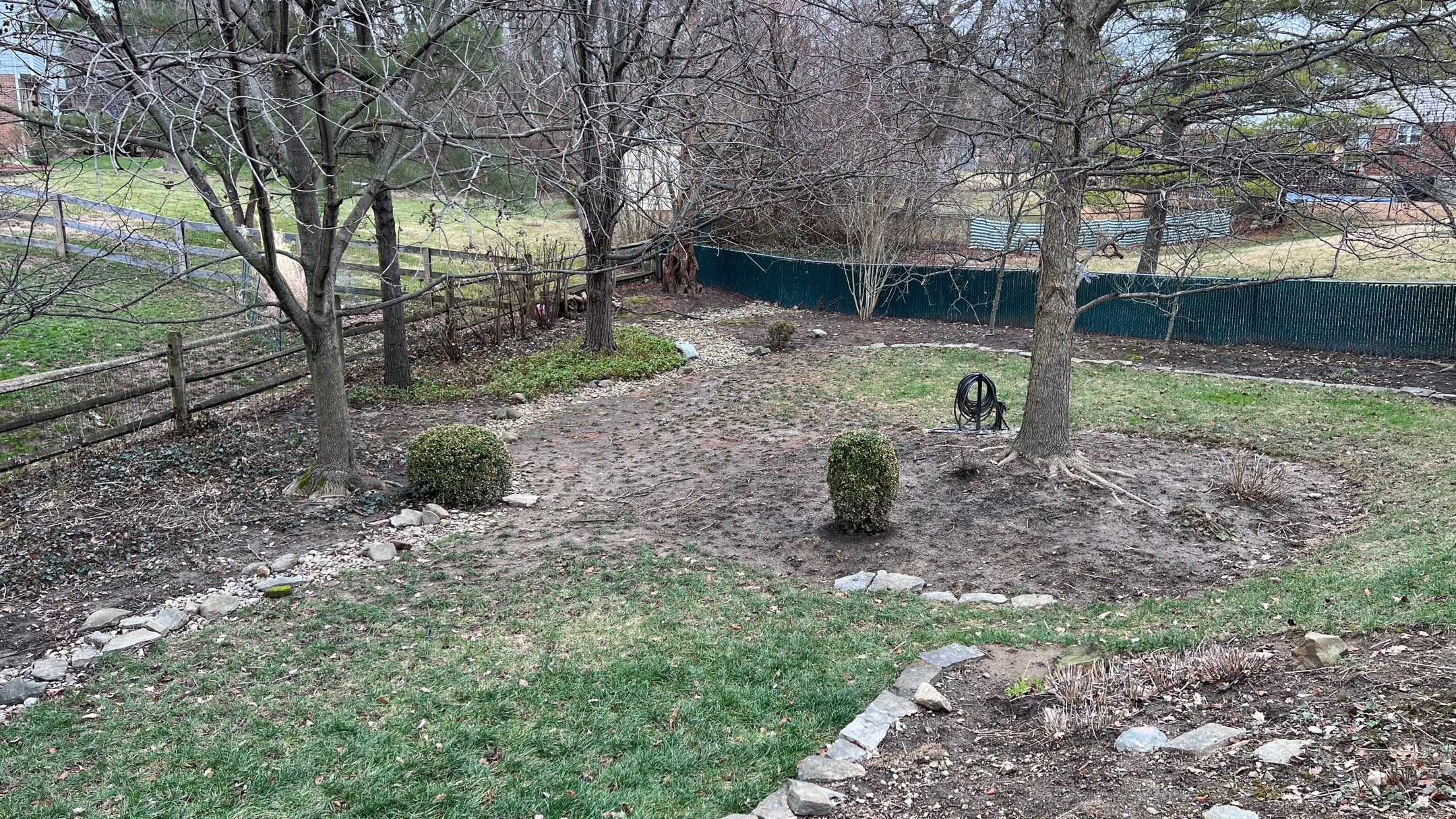 Gravel Creek Bed Installation and Paver Overlay Repair by Reisenberg’s Lawn & Landscape, LLC