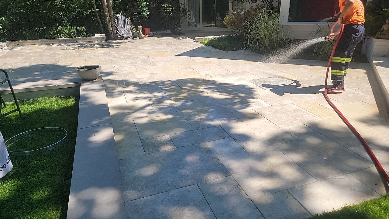 marble patio cleaning and sanding using Polysweep polymeric sand by Northern Power Washing LLC.