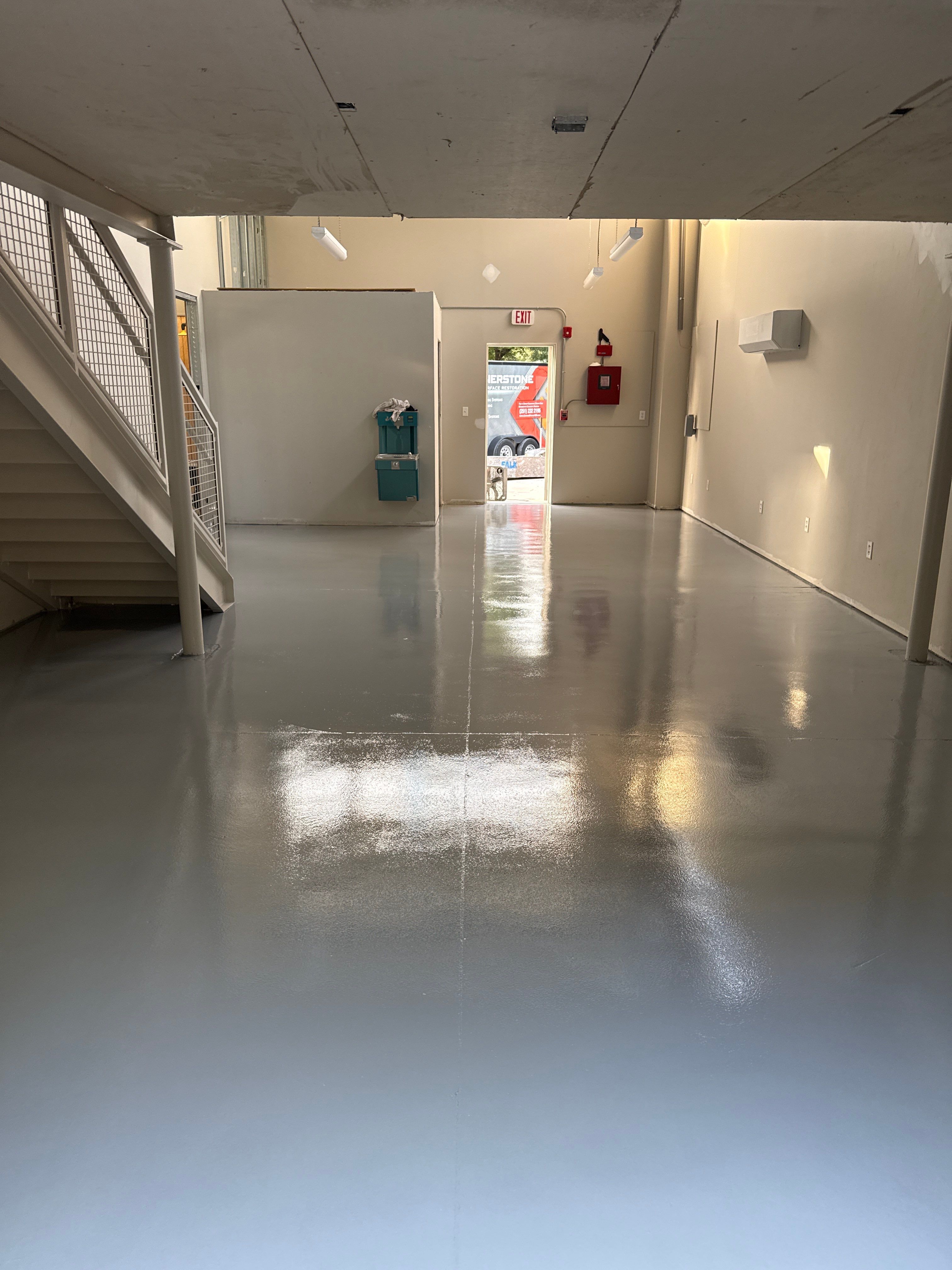 Industrial Epoxy Flooring for Sandhill Crane Workshop in Gautier by Cornerstone Hard Surface Restoration 