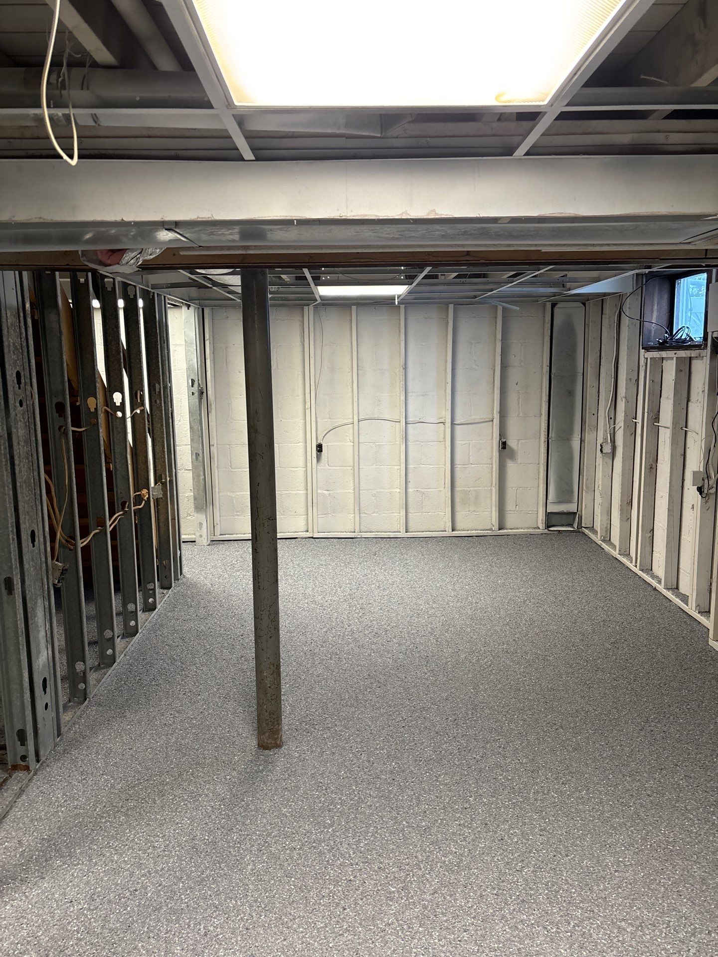 Basement Concrete Floor Coating with Penntek Flake System by Spectrum Painting, LLC