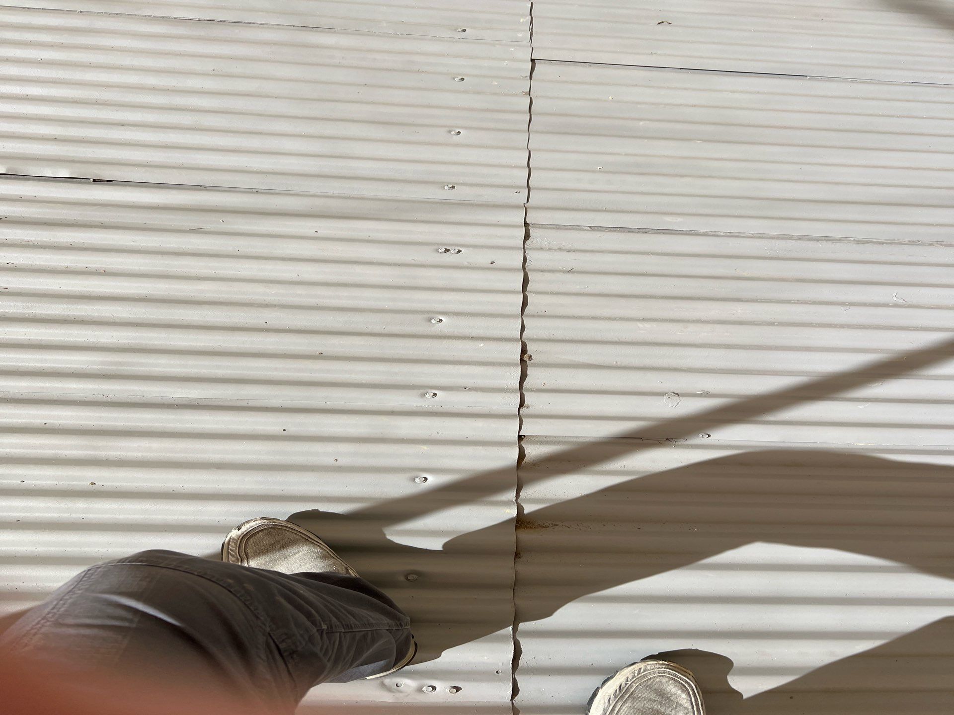 Spray foam and coatings using Conklin Benchmark/ PUMA XL acrylic coatings over metal and foam by Straight Edge Roofing Inc