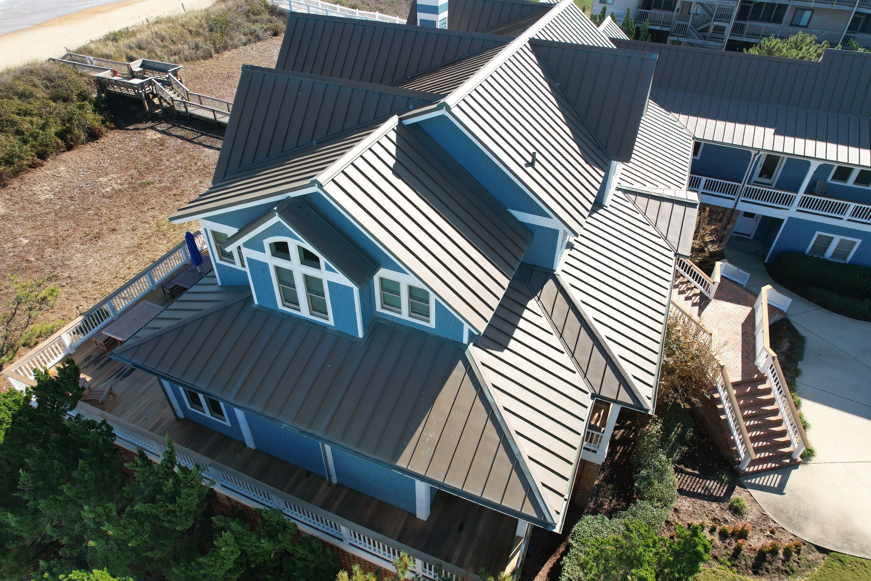 Large Metal Roof Transformation by Gallop Roofing & Remodeling, Inc.