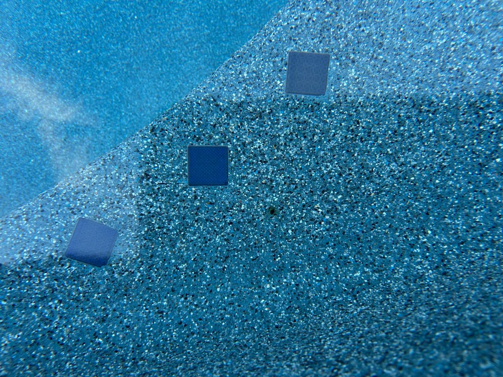 Pool and spa freeform travertine coping by Premier Pools and Spas Temecula