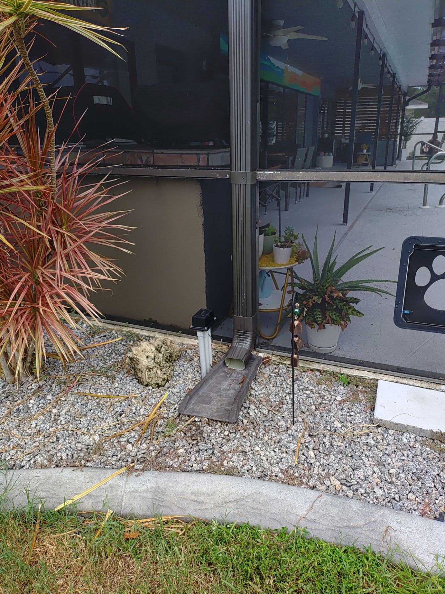 3x4 Downspouts Bronze Installation in Cape Coral FL by Gutter Professors