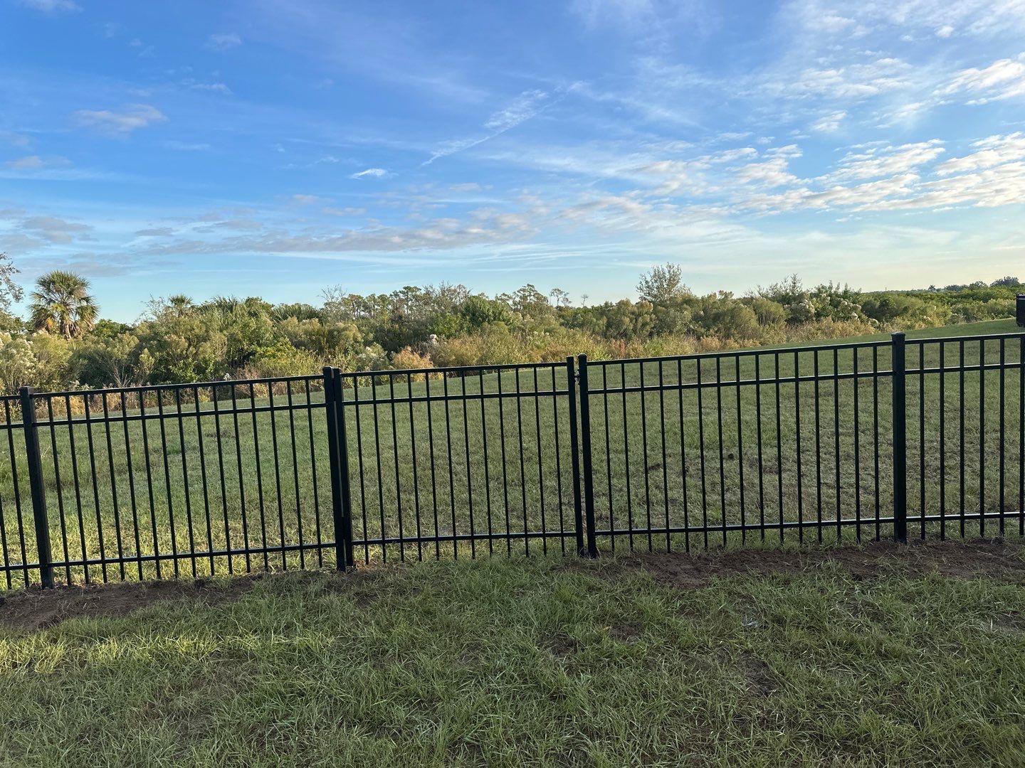 Vinyl Fence Installation using Vinyl Fence and a Black 3 Rail Aluminum Fence by Asap fence and gates, LLC