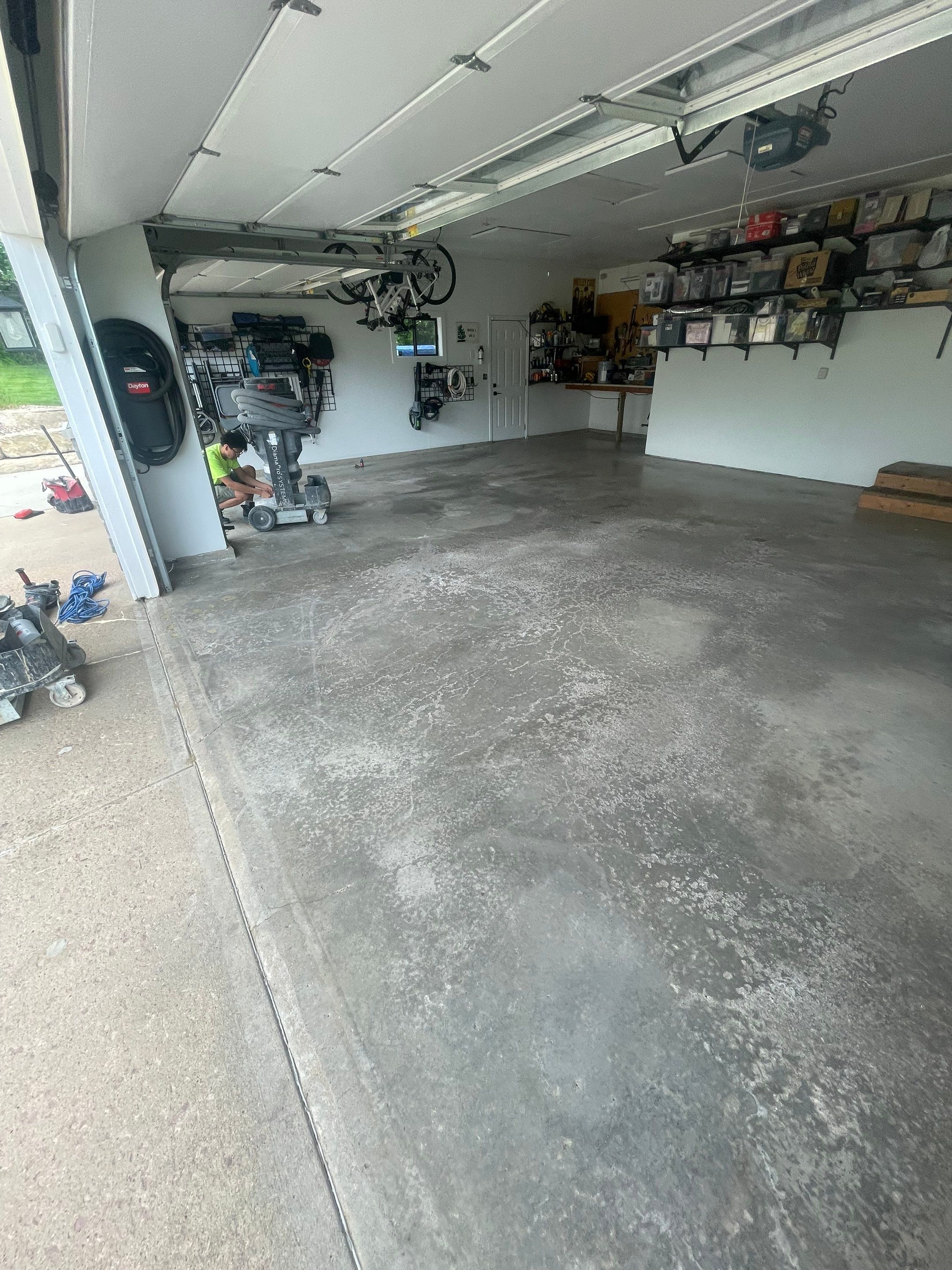 Feather Grey Garage Floor Coating Installation in Sioux Falls by Select Painting, Coatings & Garage Cabinets