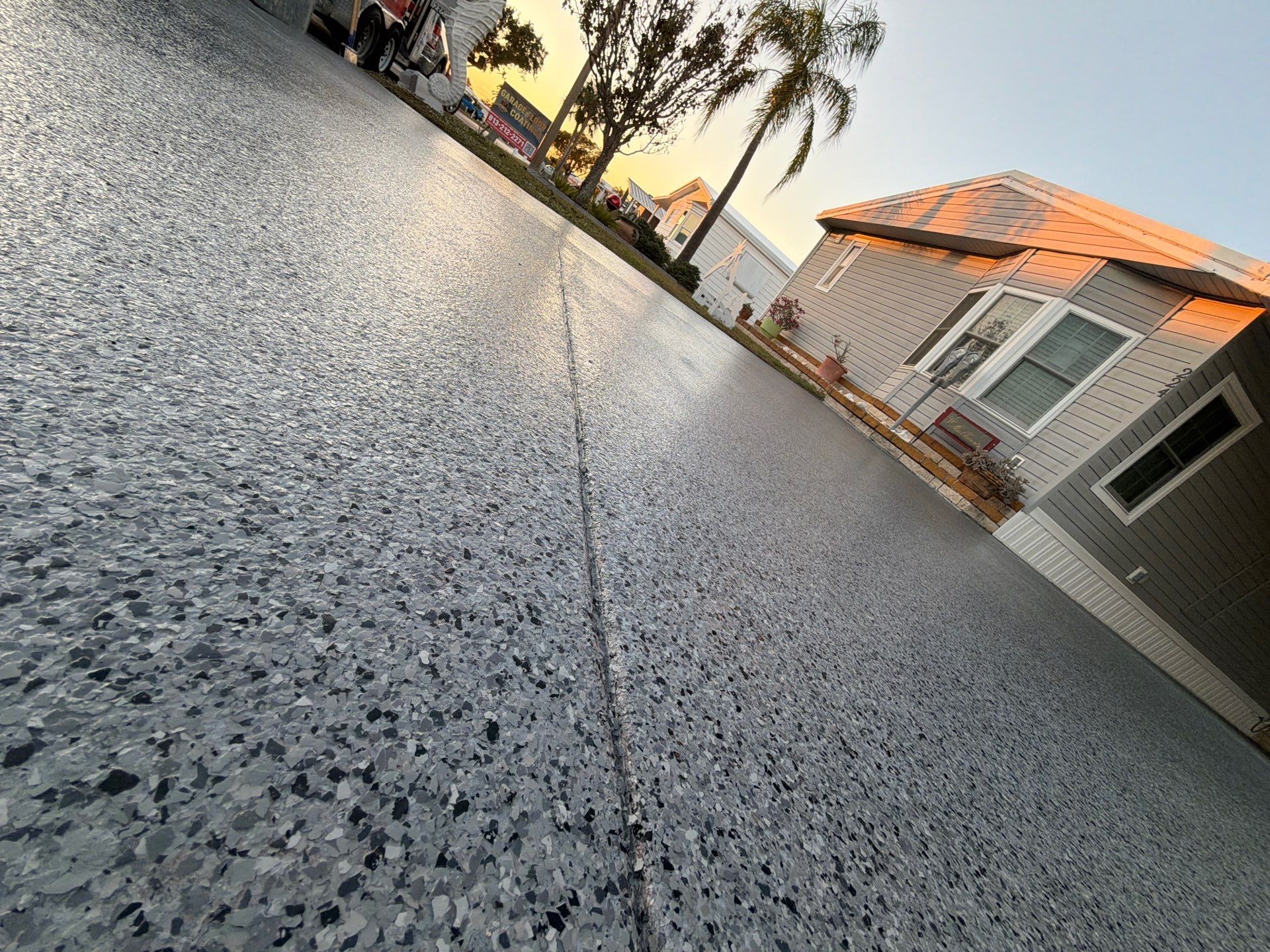 Driveway Transformation: Nightfall Flake System with Full UV & Moisture Protection by Performance Floors & Coating