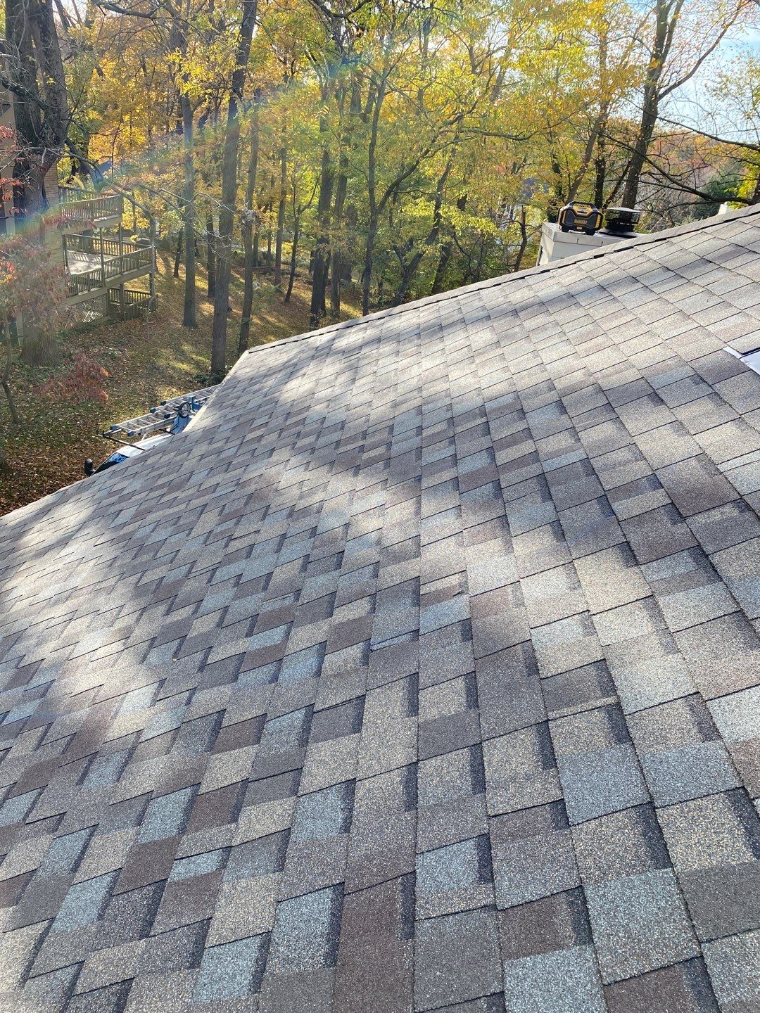 Install new shingles and new skylights  by Alpha Design Services