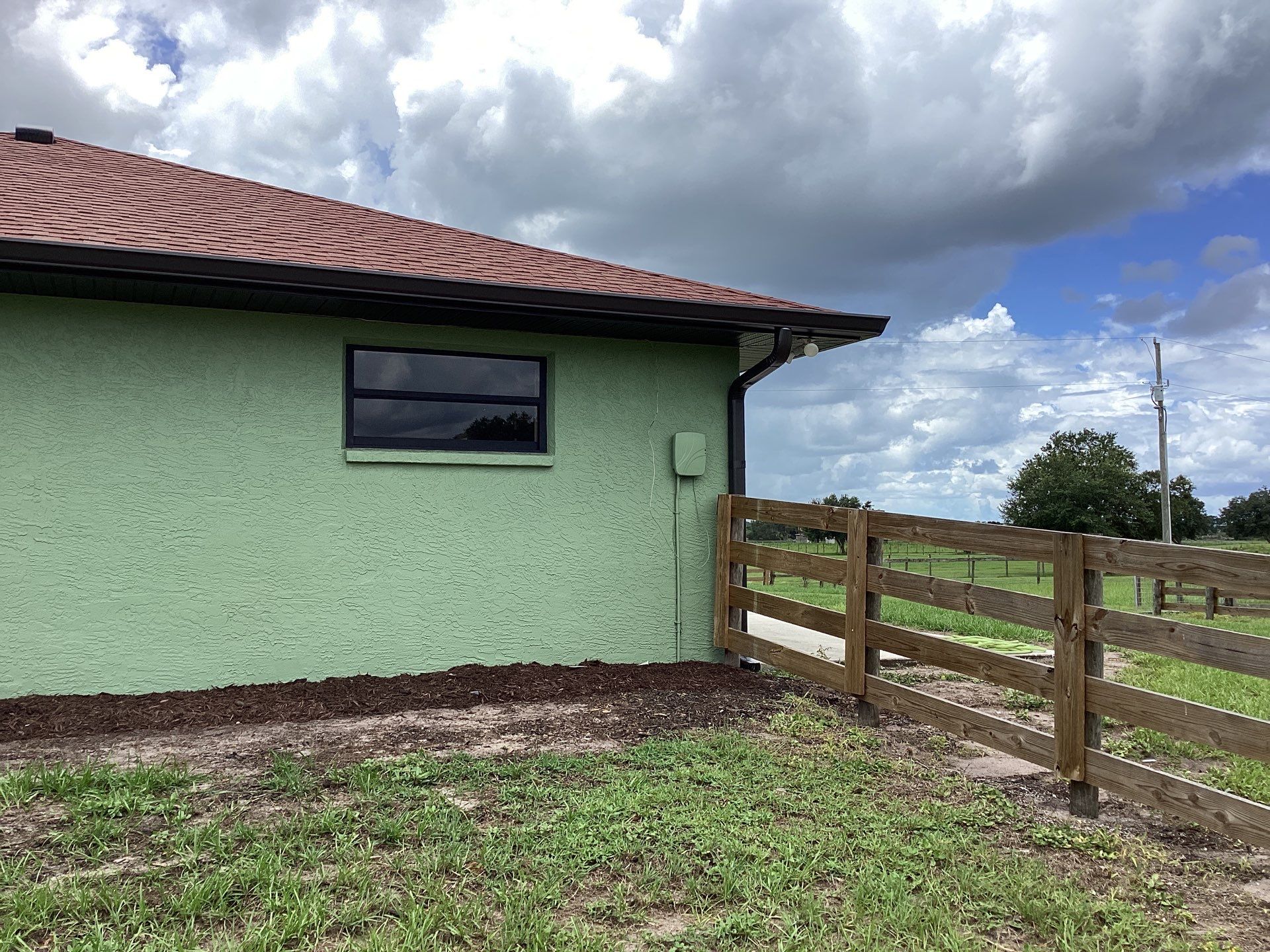 Musket brown downspouts with 6-inch K-Style gutter installation in Myakka City, FL by Gutter Professors