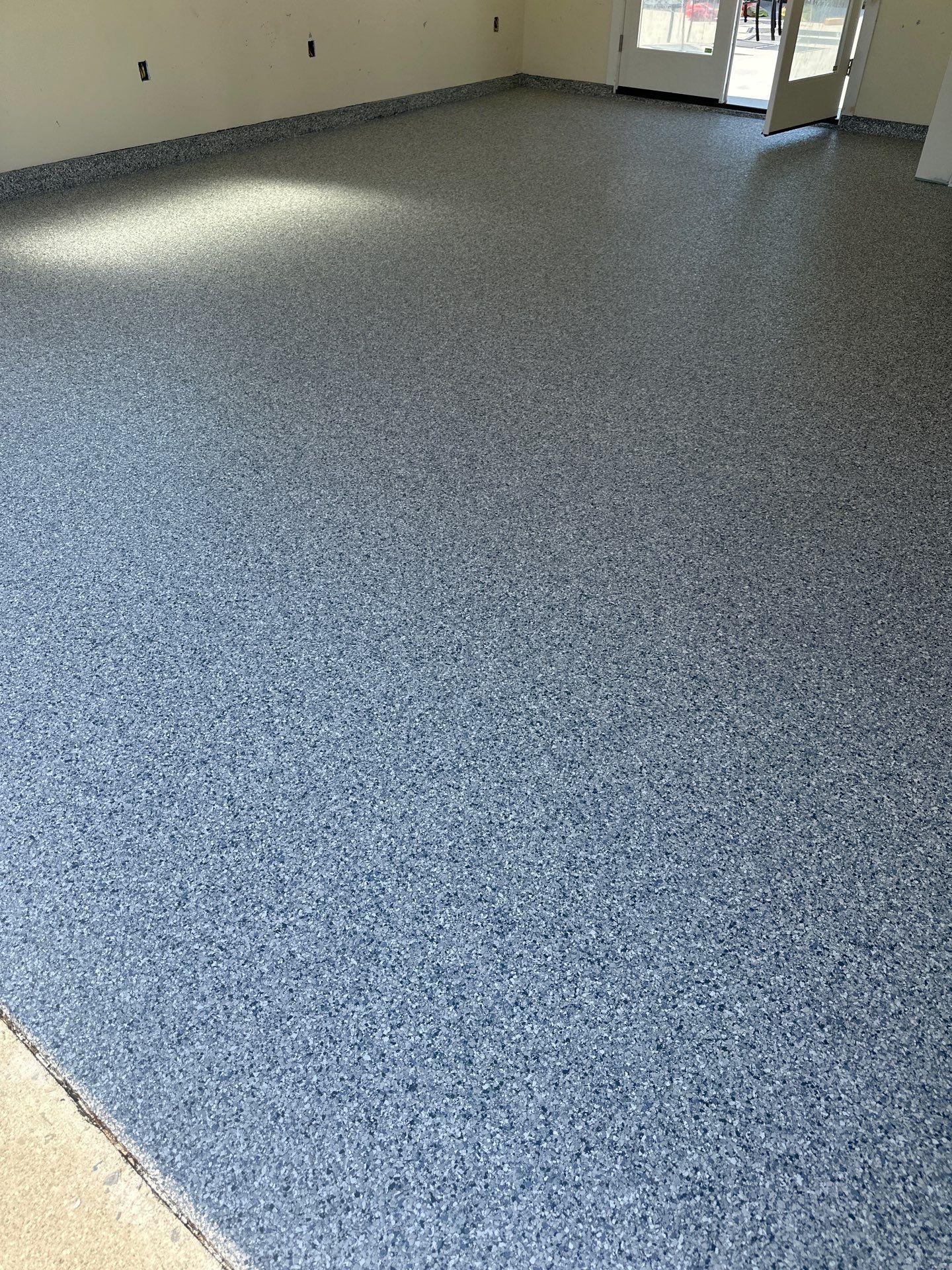 Polyurea Garage Floor Coating with Tidal Wave Flake Finish by MGP Coatings