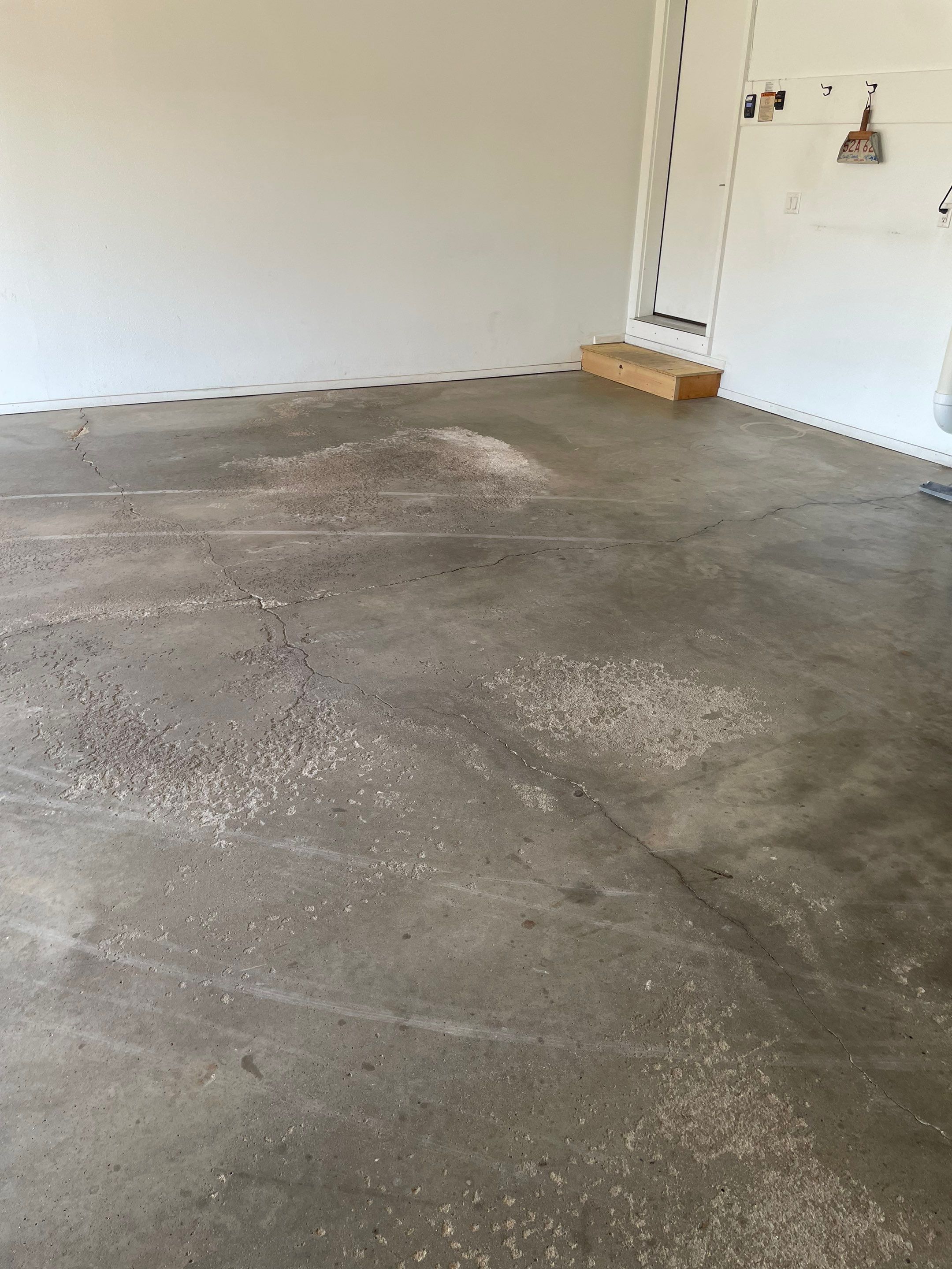 Yankton Garage Floor Restoration with Gray Speckled Epoxy Coating by Select Painting, Coatings & Garage Cabinets