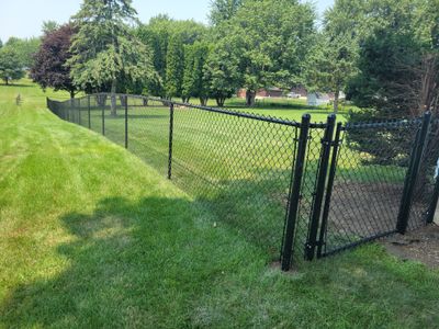 Black Vinyl-Coated Chain Link Fence Installation in New Hampton