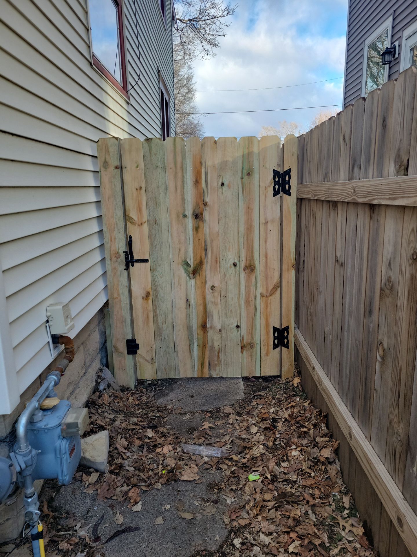 Pressure-Treated Wood Privacy Fence and Double Gate Installation in Waterloo by Perfect Picket Fence and Stain