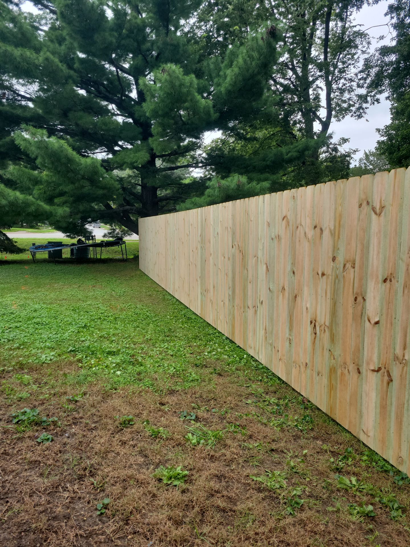 Pressure-Treated Wood Privacy Fence Installation in Waverly by Perfect Picket Fence and Stain