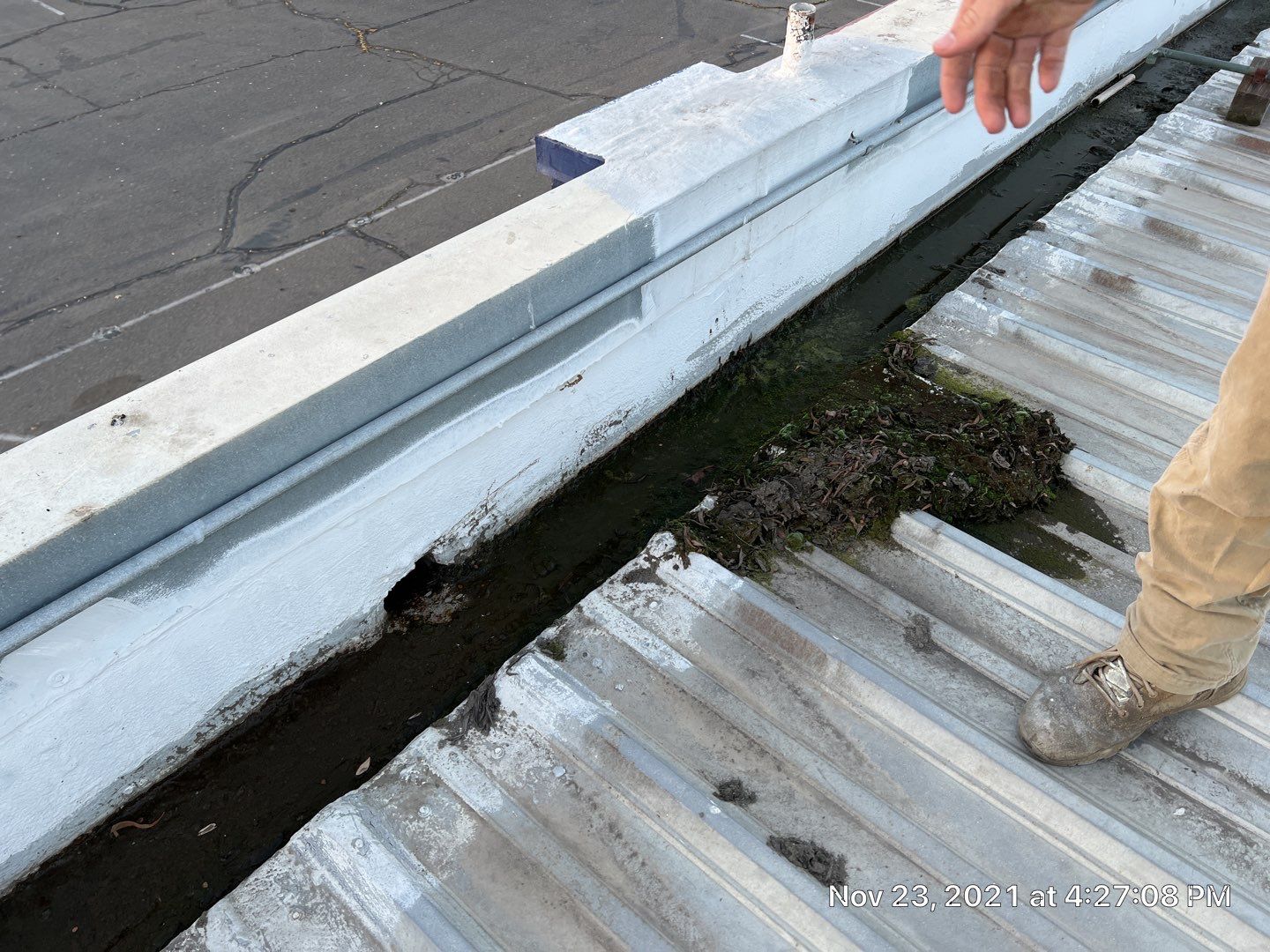 Metal roof restoration on commercial roof using Conklin Benchmark/ PUMA XL acrylic coatings over metal and foam by Straight Edge Roofing Inc