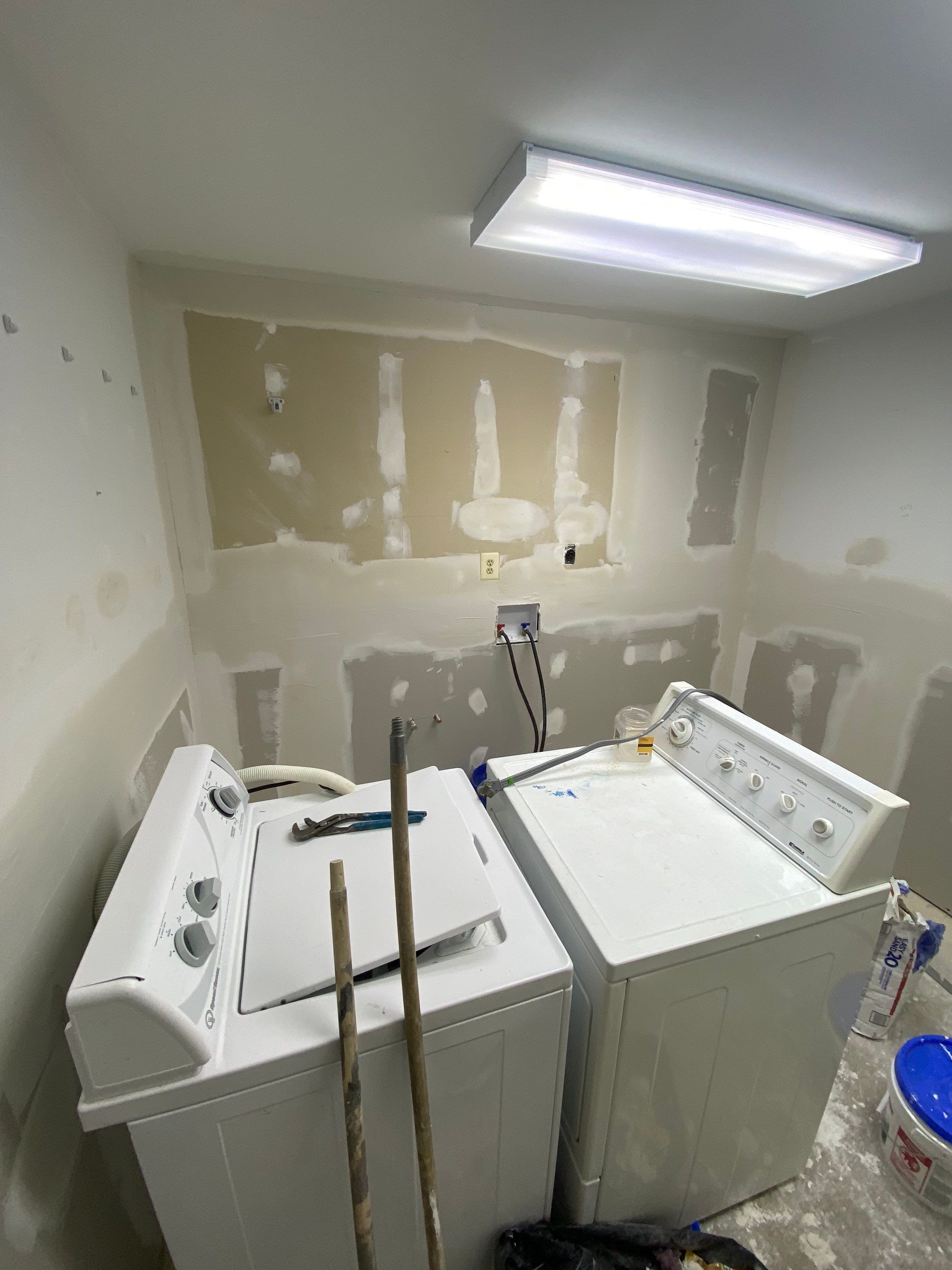 Laundry Room Redmodel using Lifeproof Luxury Vinyl Plank Flooring by The Smet Companies, LLC