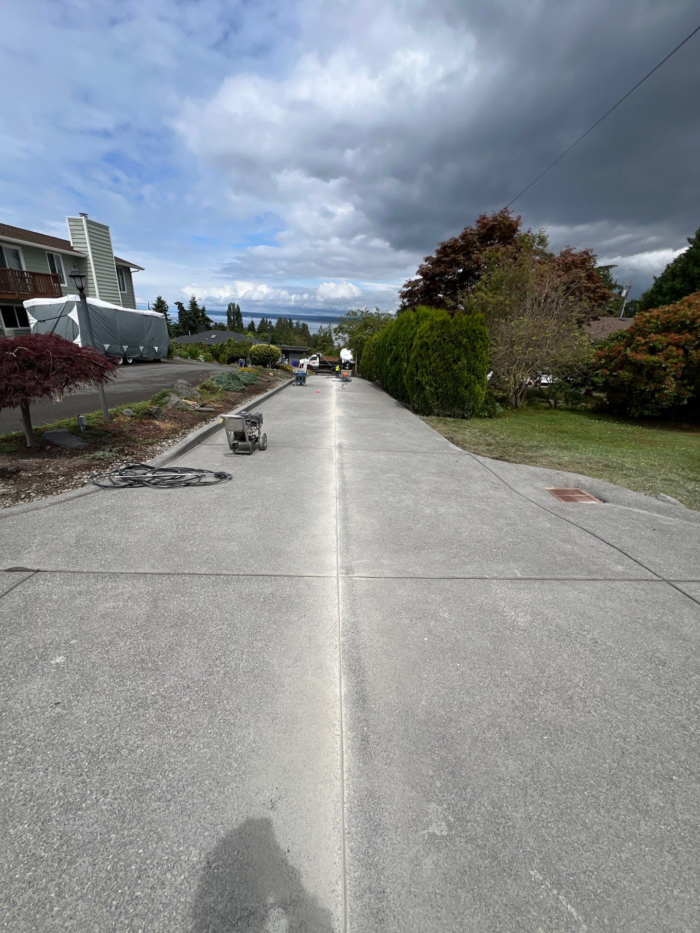 Concrete Driveway Makeover w/ Asphalt Patch | Everett  by Jireh Asphalt & Concrete Inc 