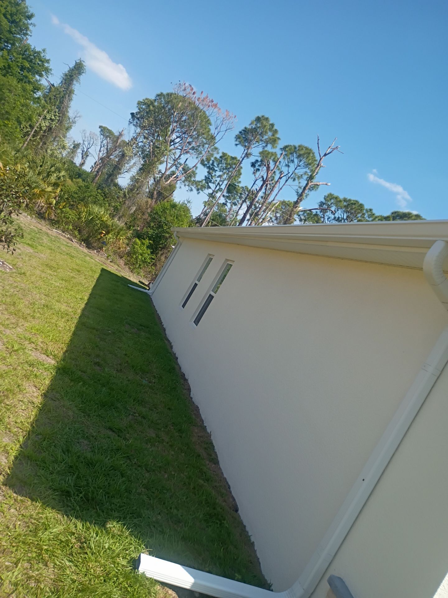 6-inch K-style White Seamless Gutters with Downspouts in North Port, FL by Gutter Professors