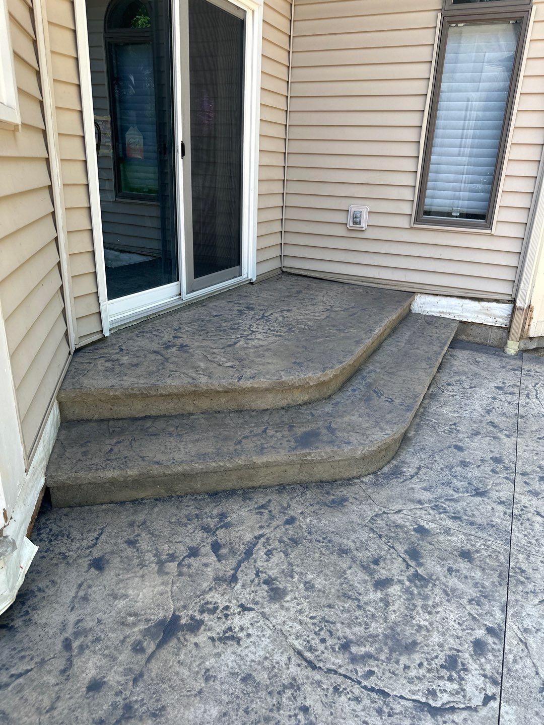 Heavy stone stamped concrete patio and sidewalk  by NG Masonry & Construction LLC