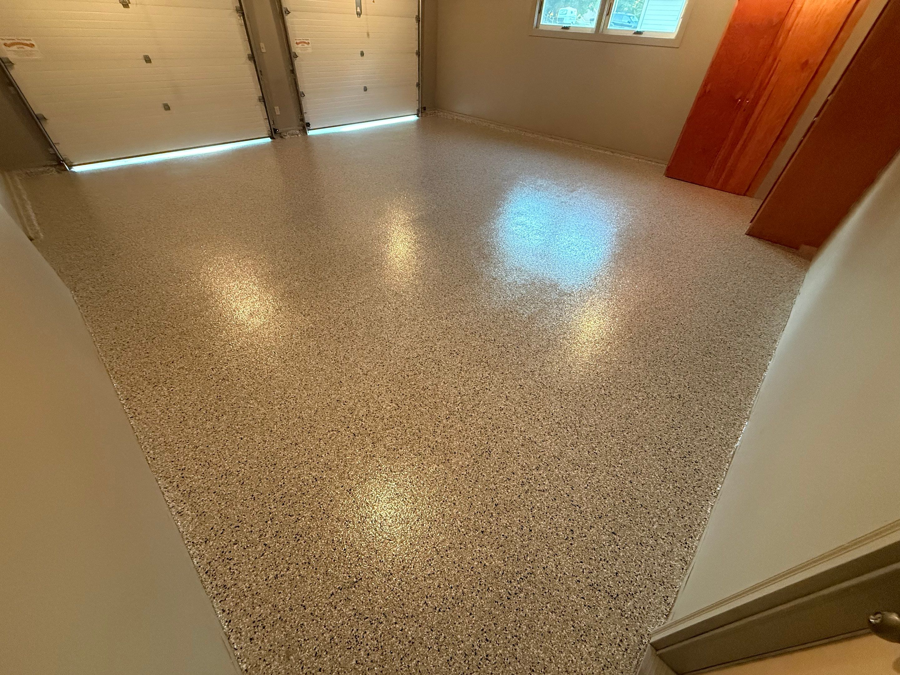 Cabin Fever Concrete Coating for Sioux Falls Garage by Select Painting, Coatings & Garage Cabinets