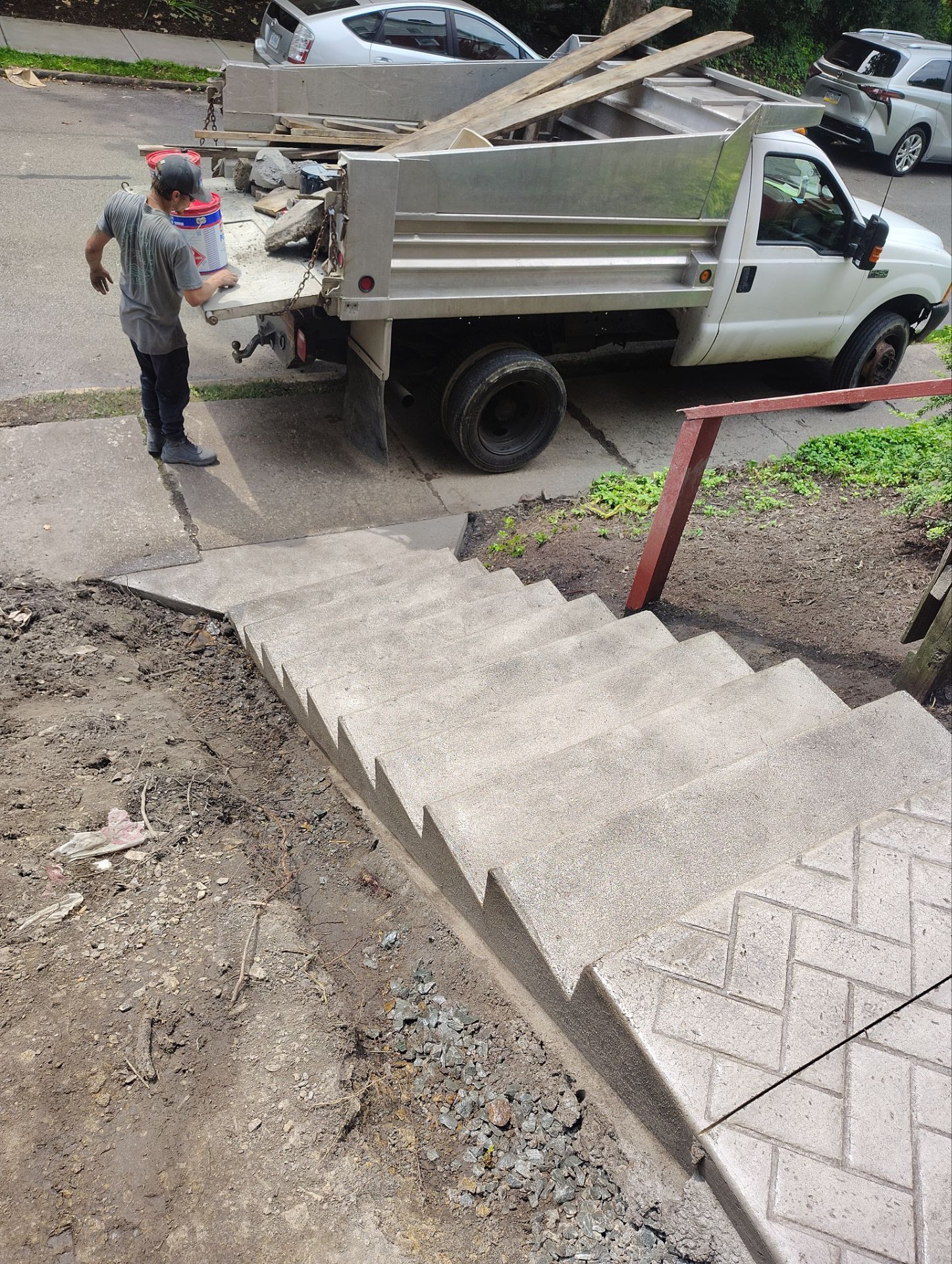 Stamped Concrete and Retaining Wall by Cousins Roofing Siding & Decks